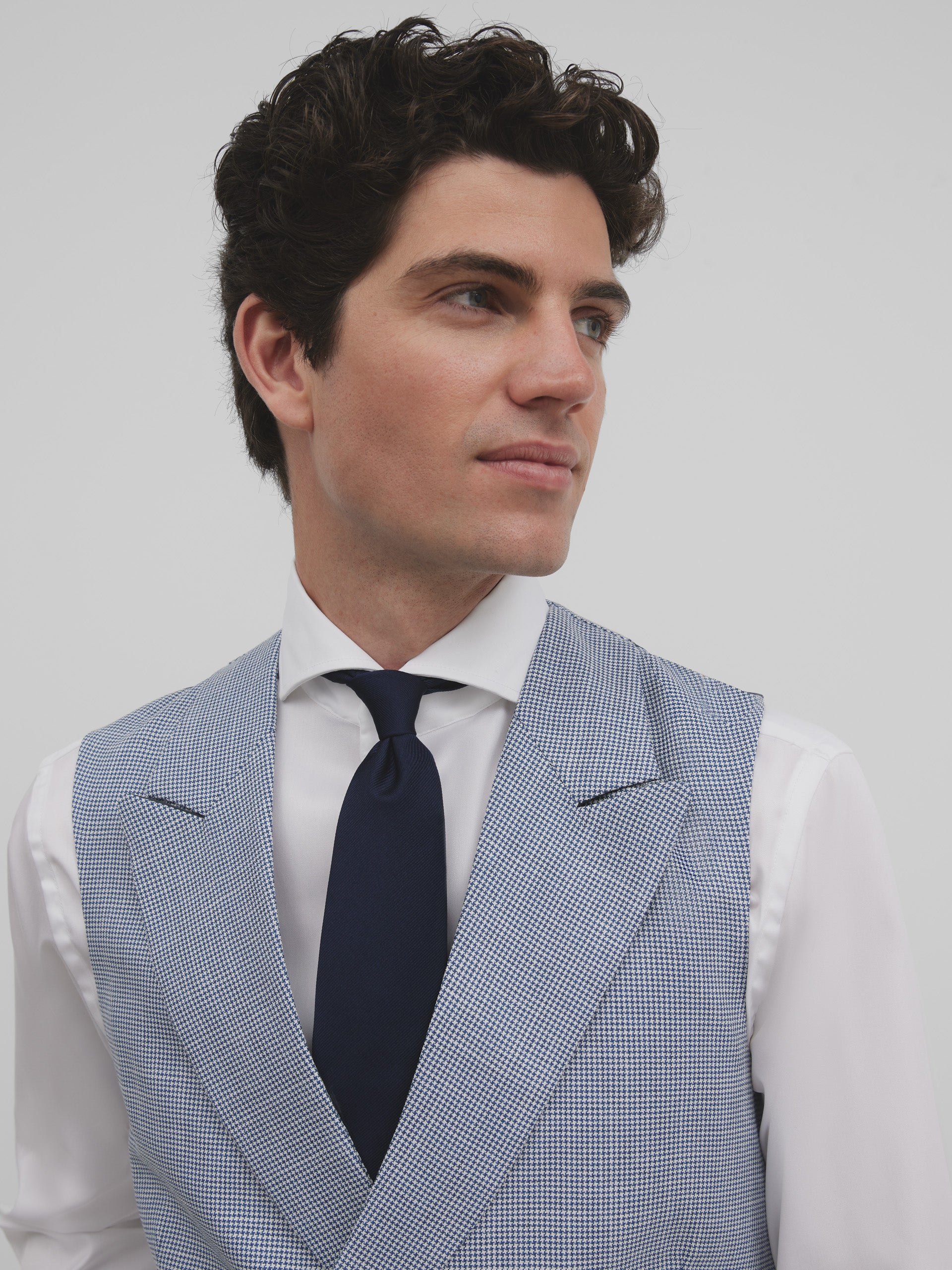 Colete clássico de padrão pied-de-poule azul