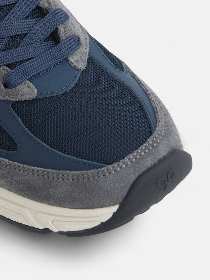 Zapatilla running tono azul