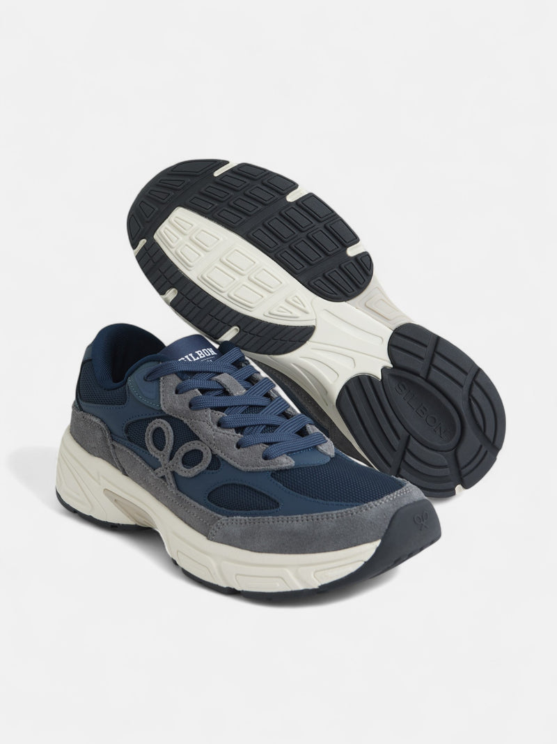 Zapatilla running tono azul