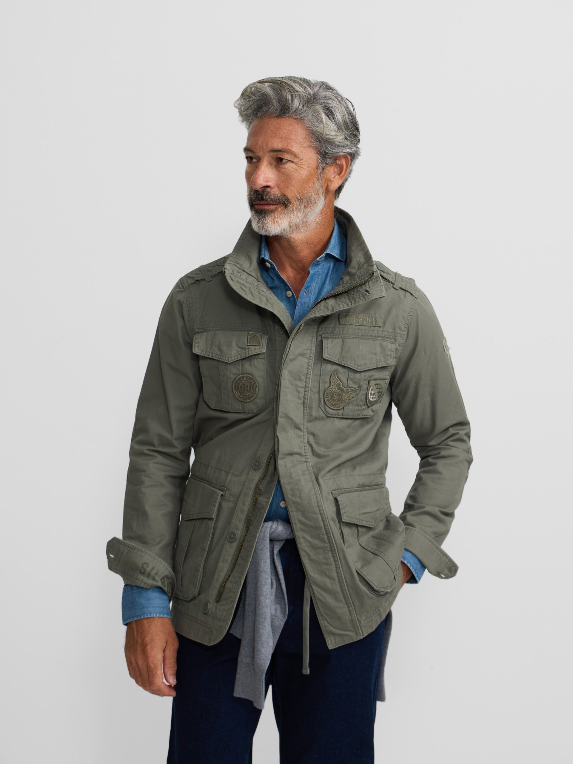 Military jacket with green dye patches