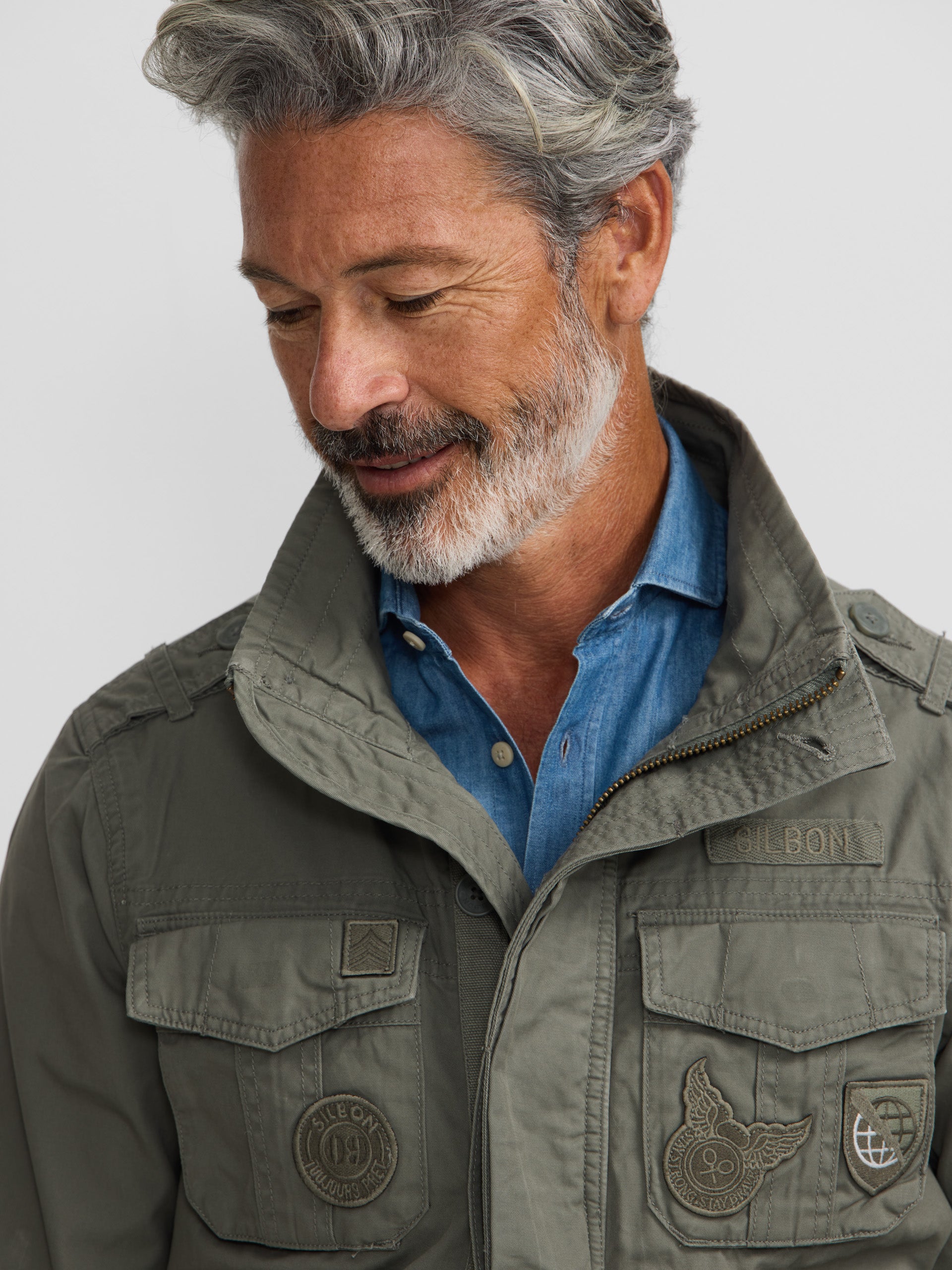 Military jacket with green dye patches