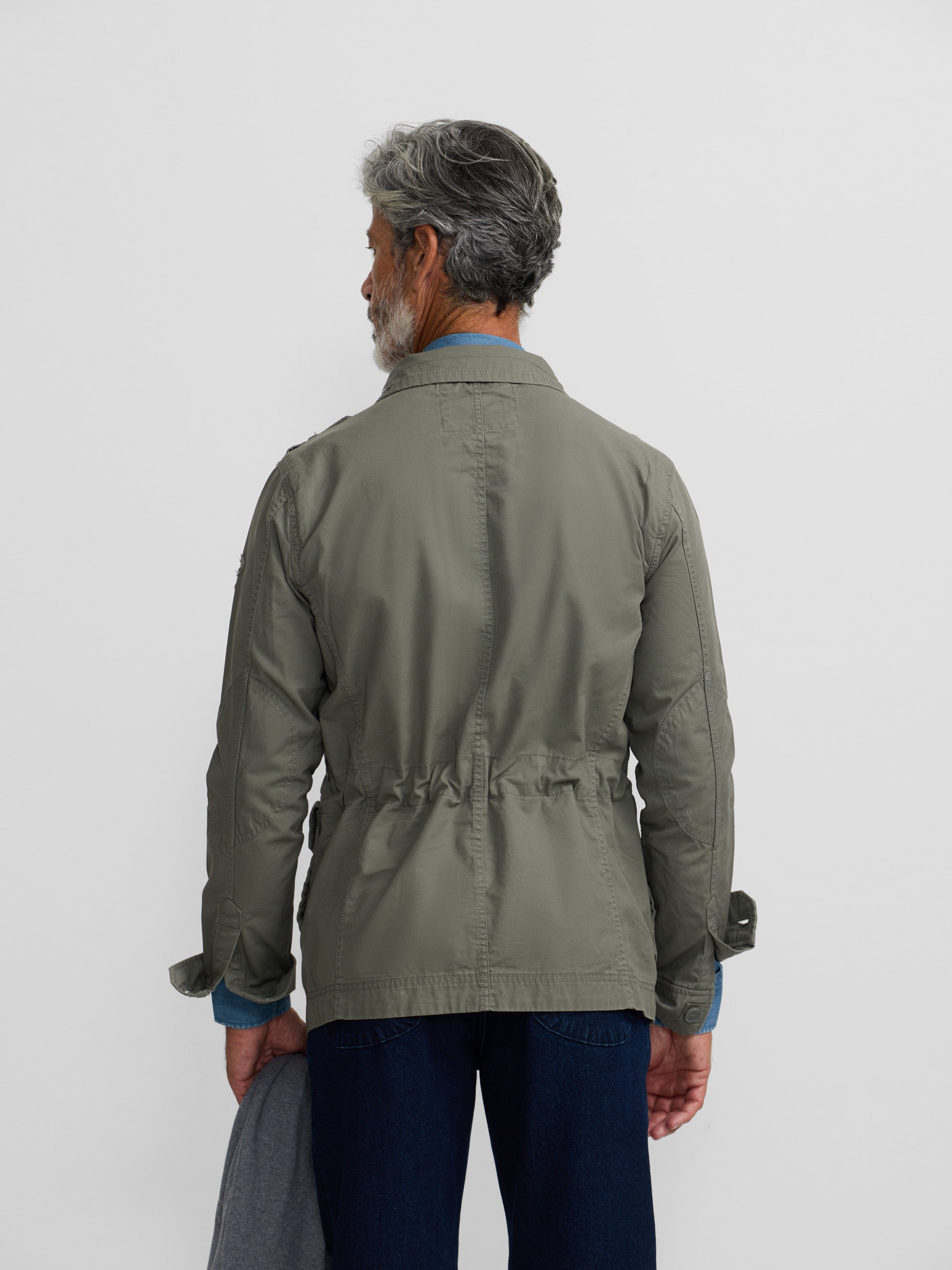Military jacket with green dye patches