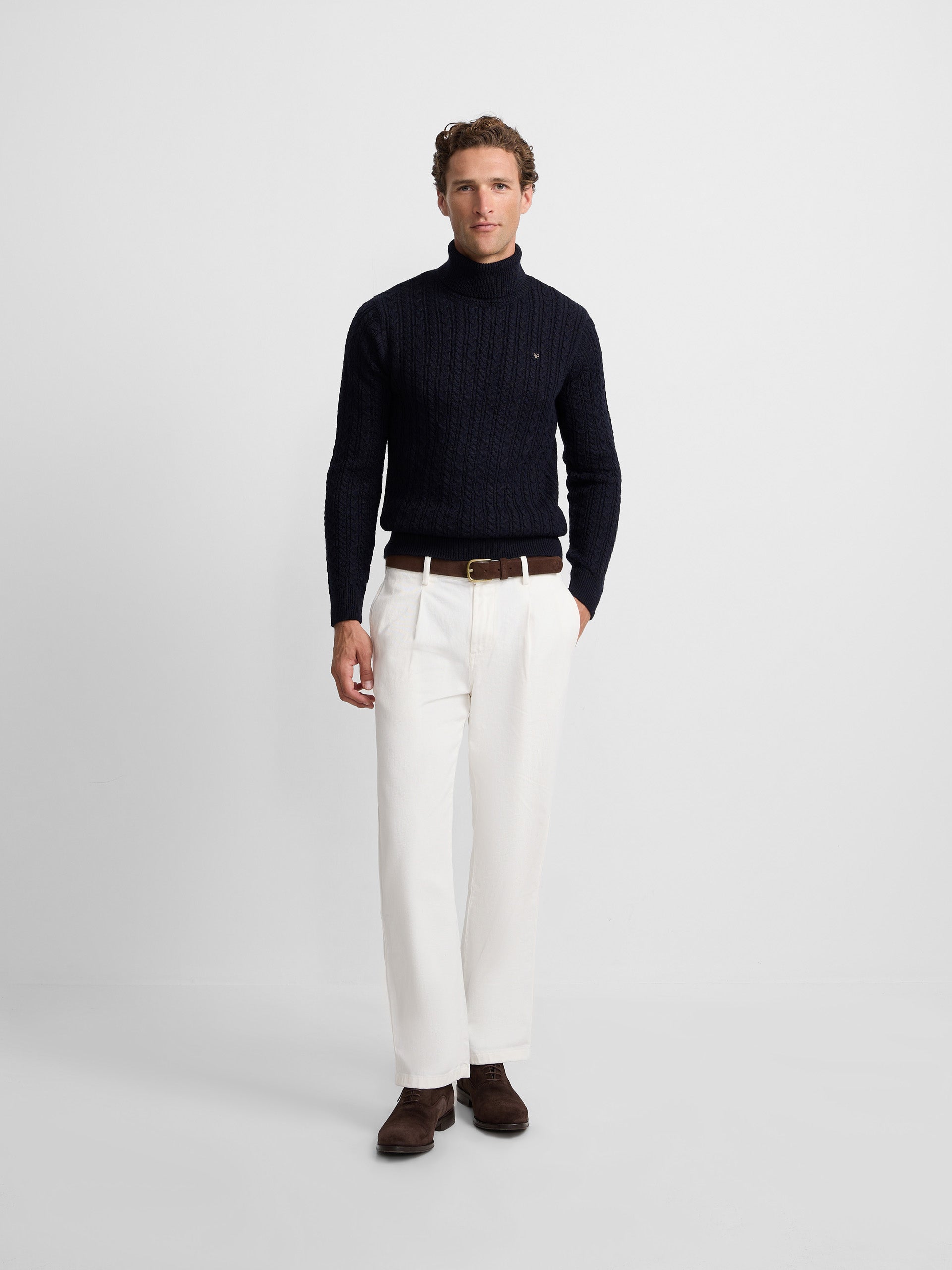 Navy blue cable knit turtleneck sweater