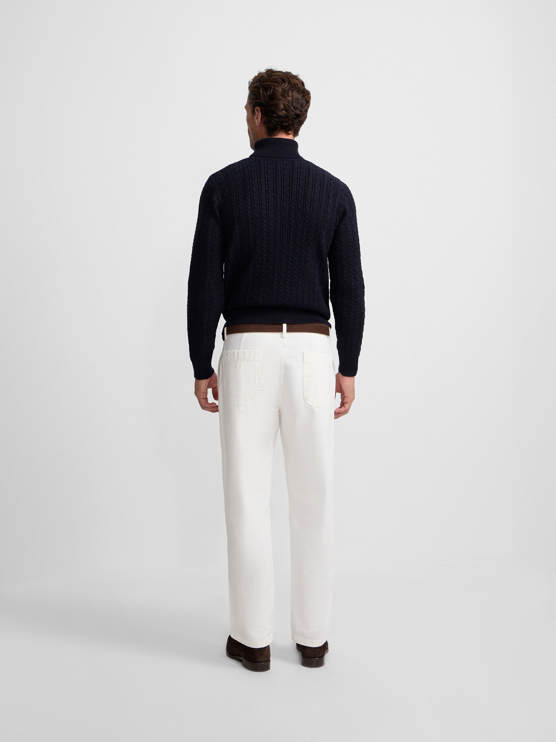 Navy blue cable knit turtleneck sweater