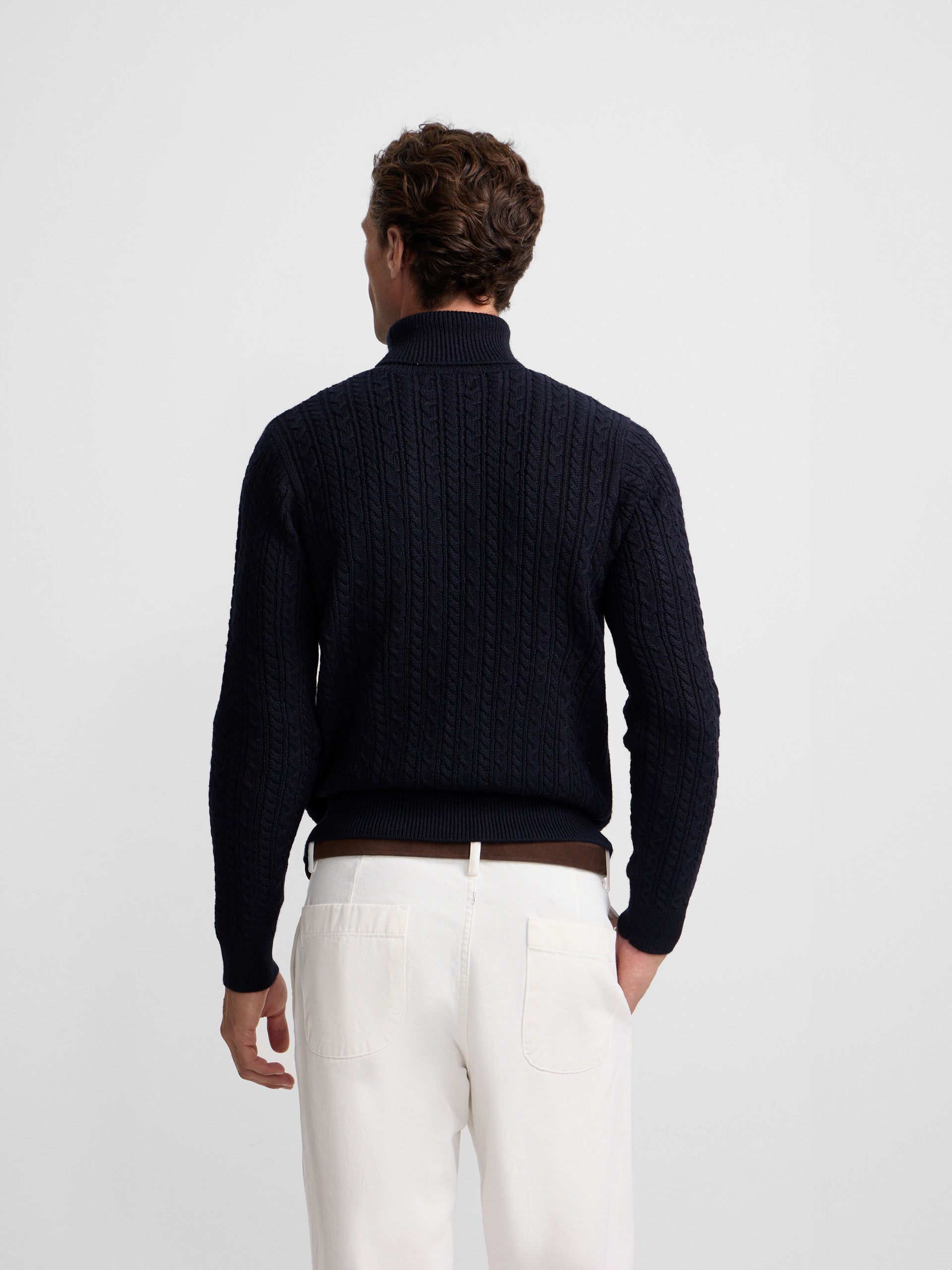 Navy blue cable knit turtleneck sweater