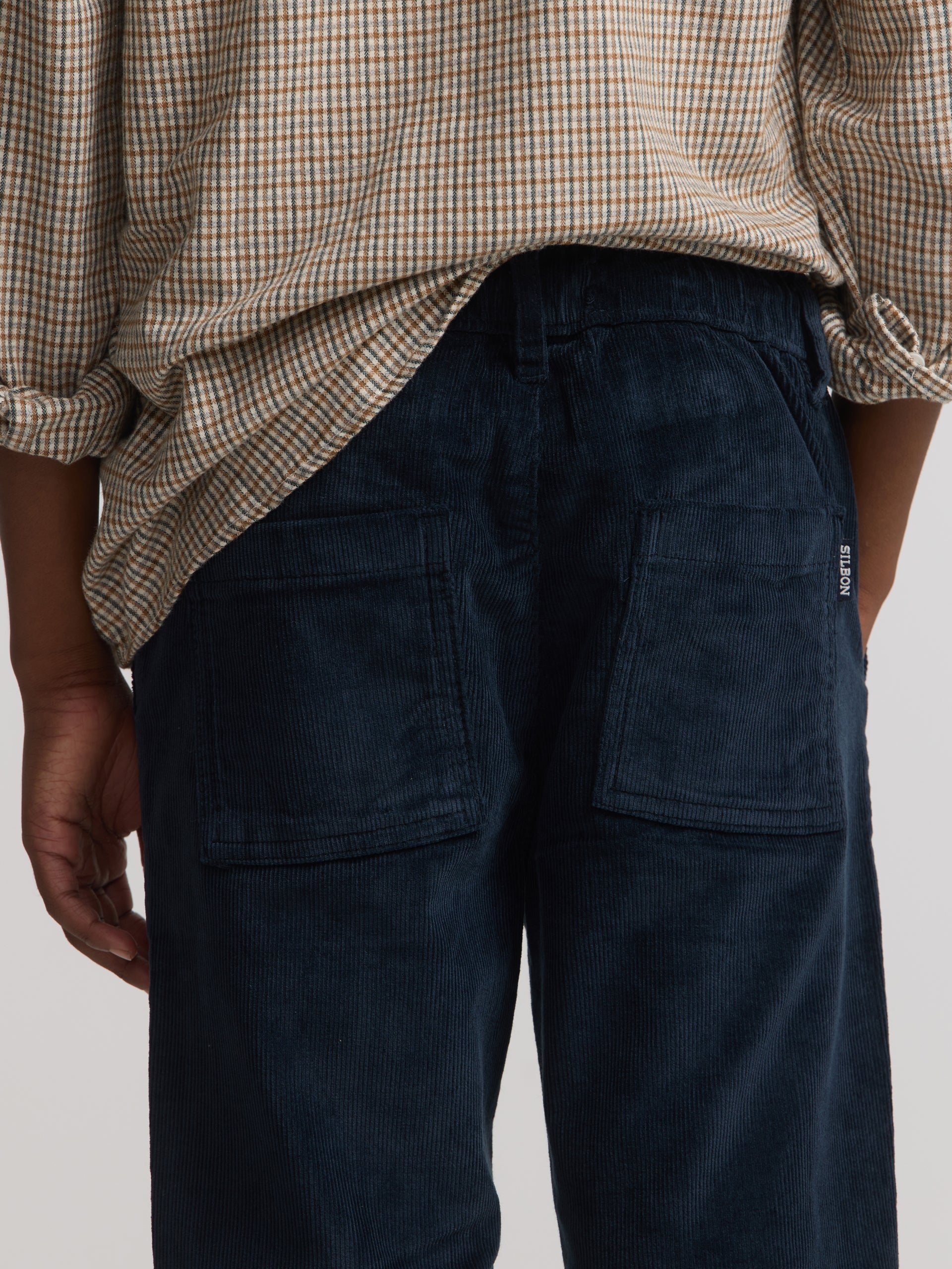 Kids' sport trousers with pockets, navy blue corduroy