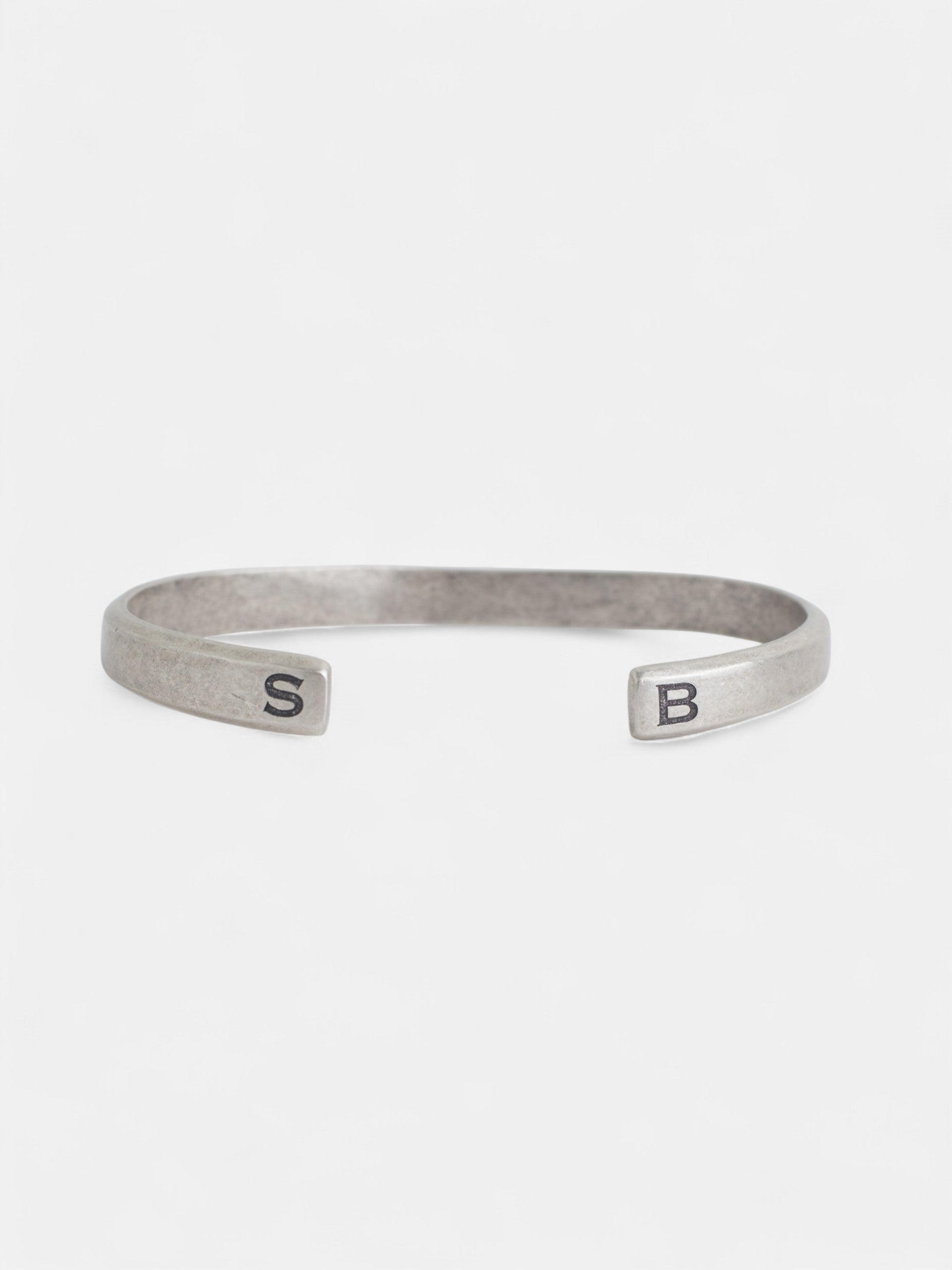 Pulsera metalica grabada