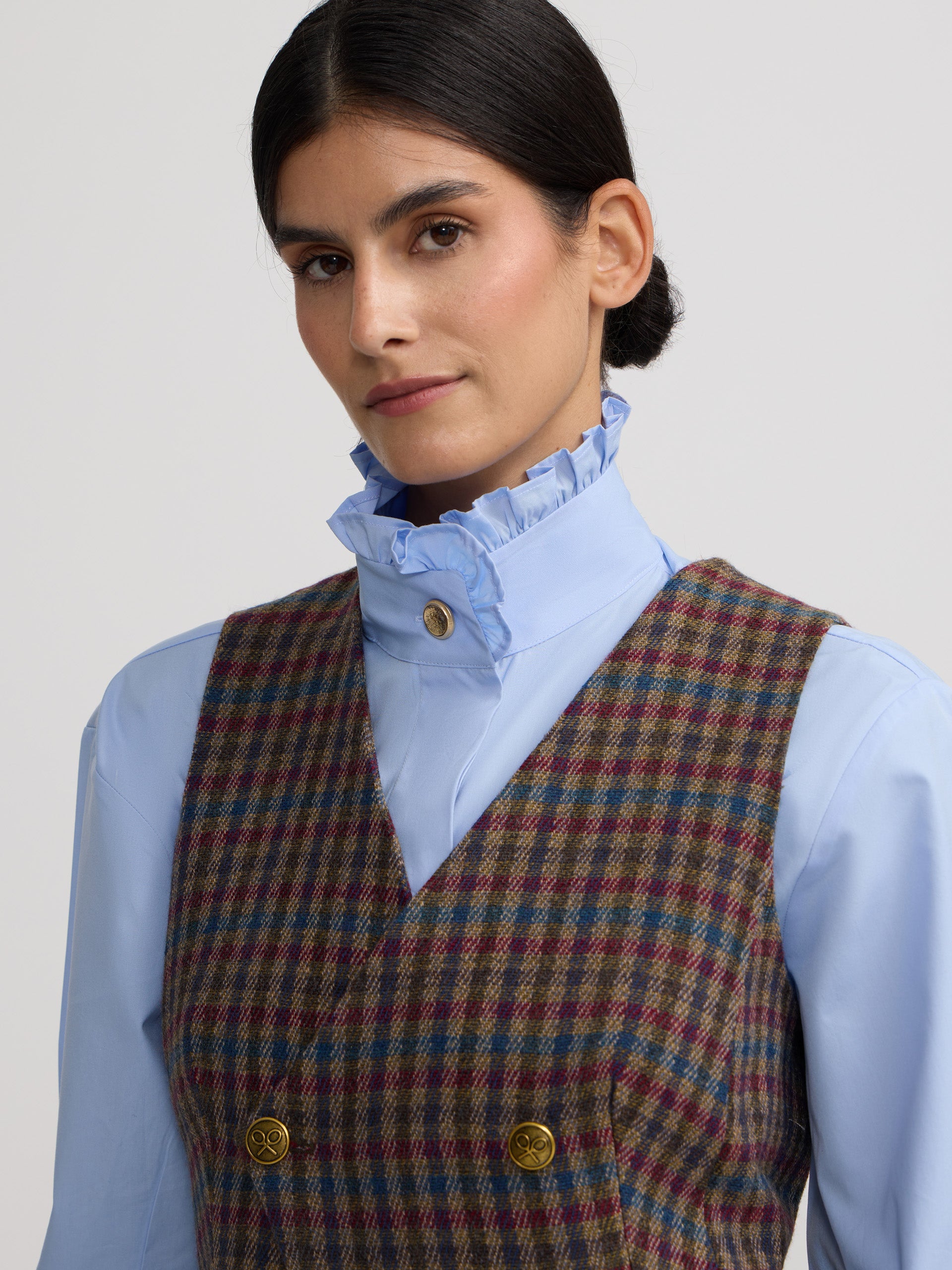 Colete cruzado clássico com padrão de quadrados verdes