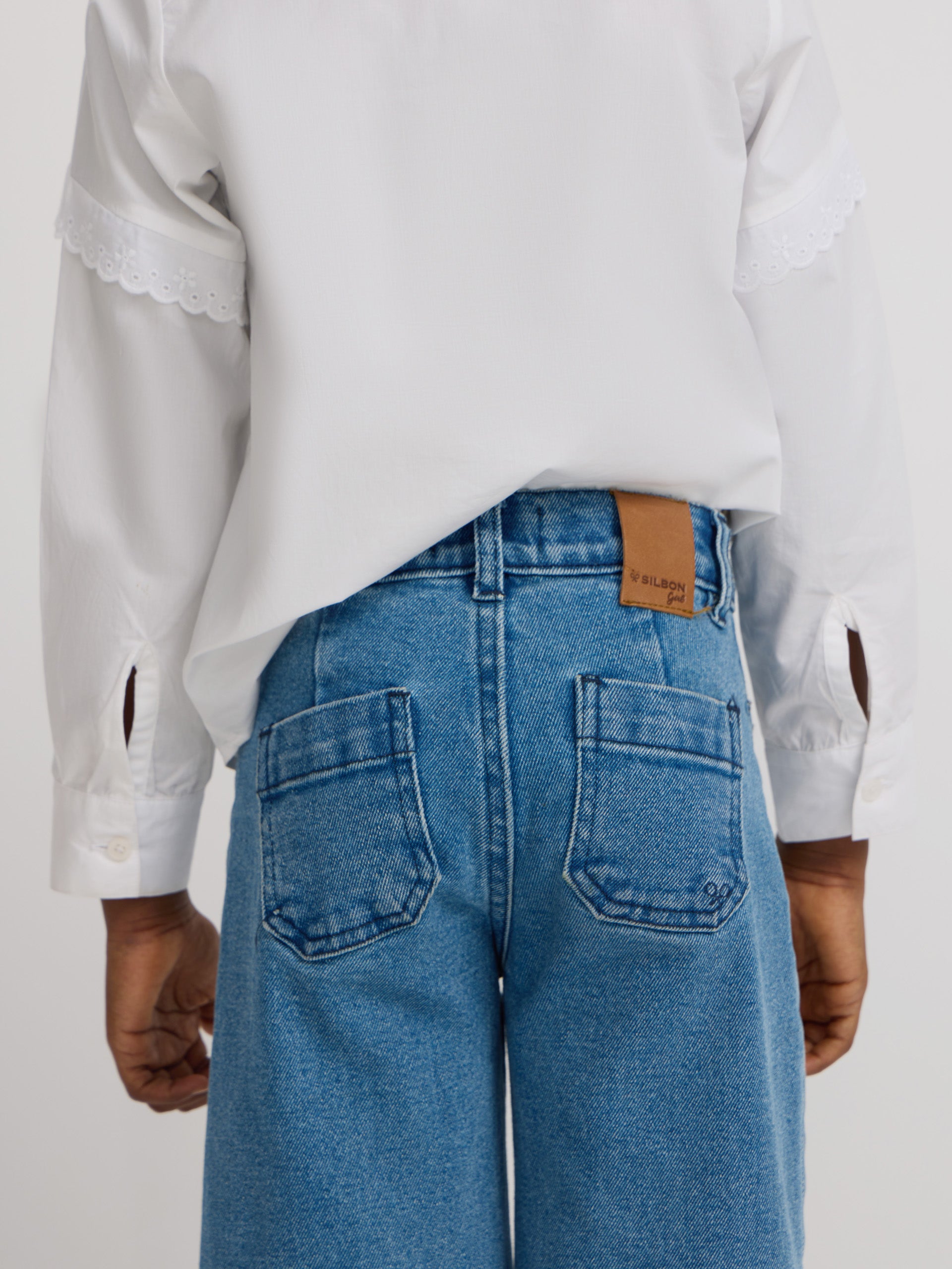 Girl's pants with braided pockets and denim