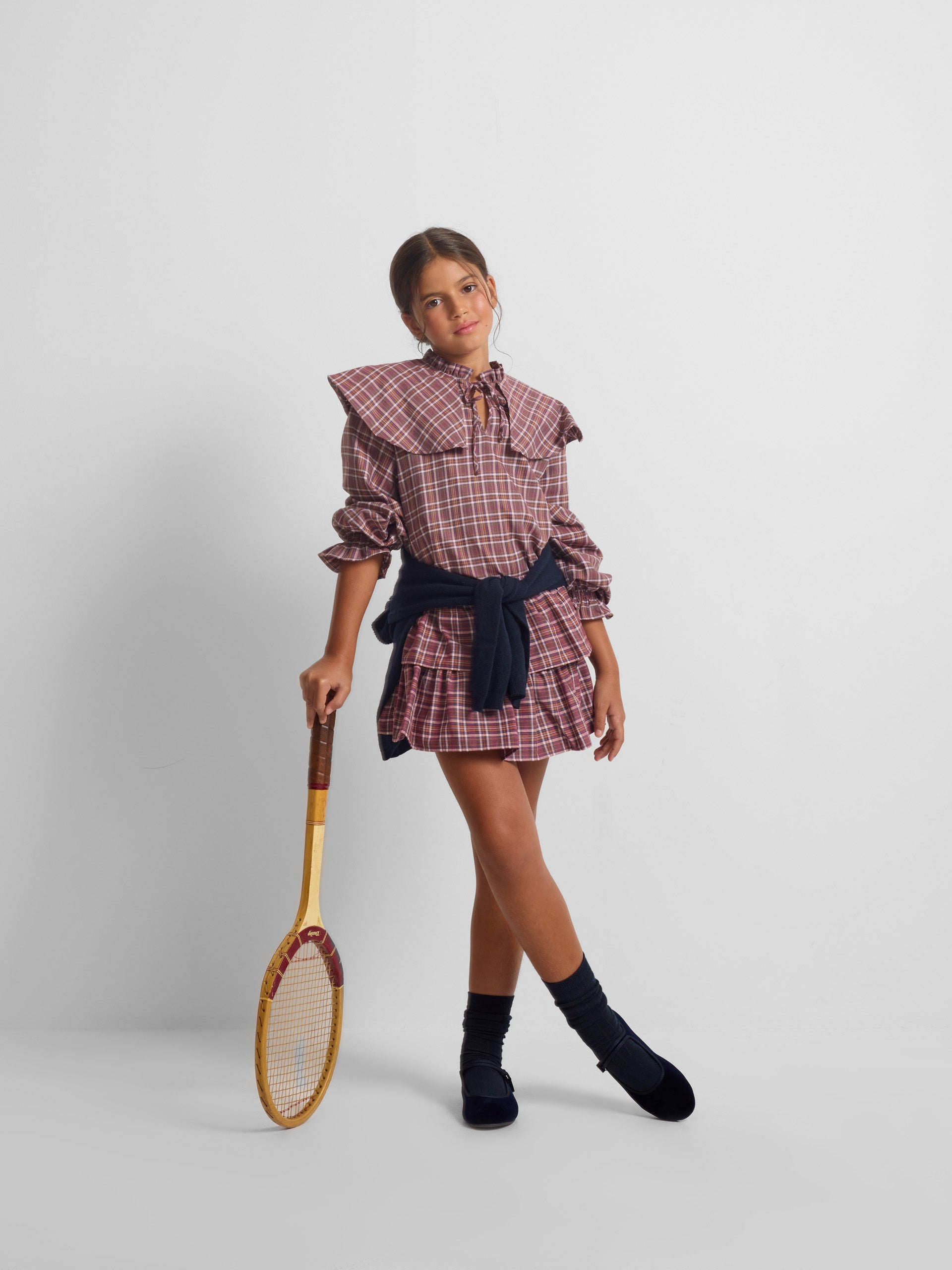 Saia de menina com folhos e padrão de xadrez roxo e rosa