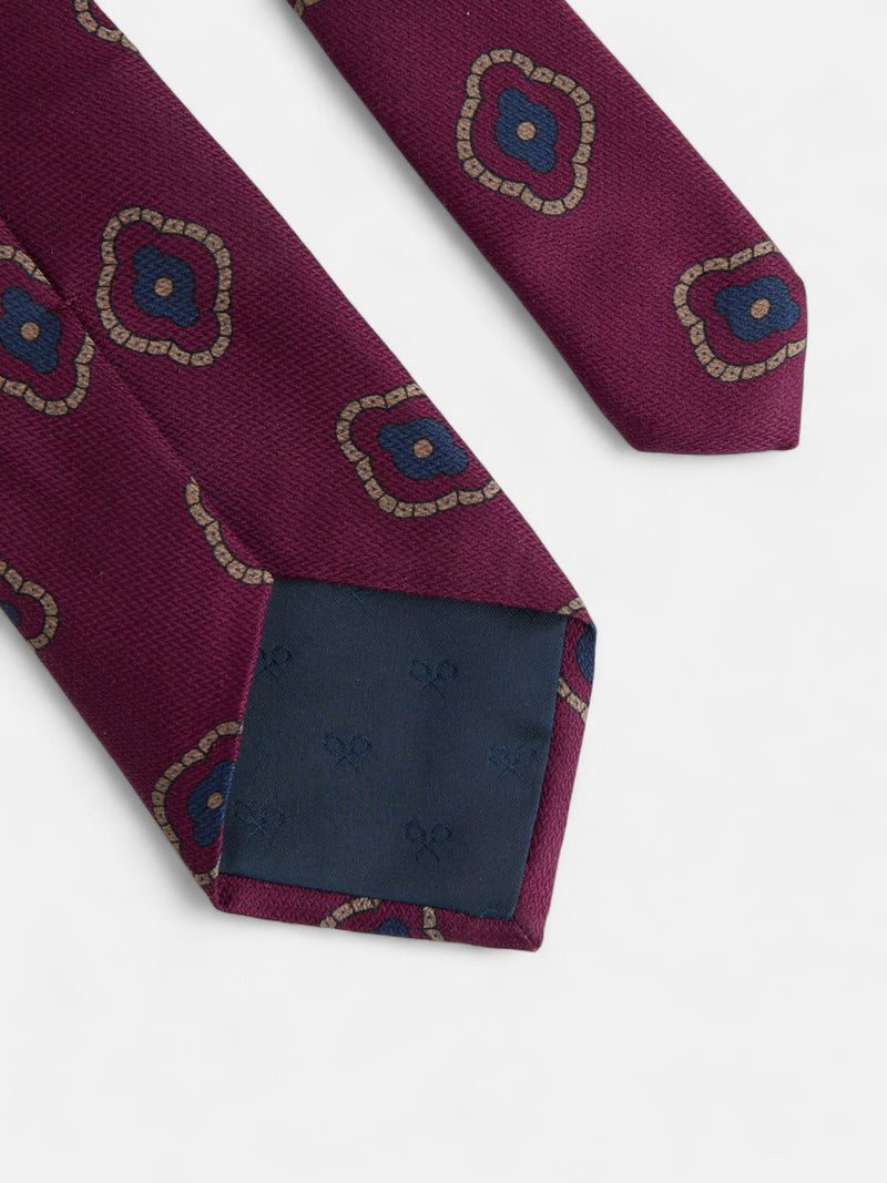 Burgundy tie with irregular geometric pattern