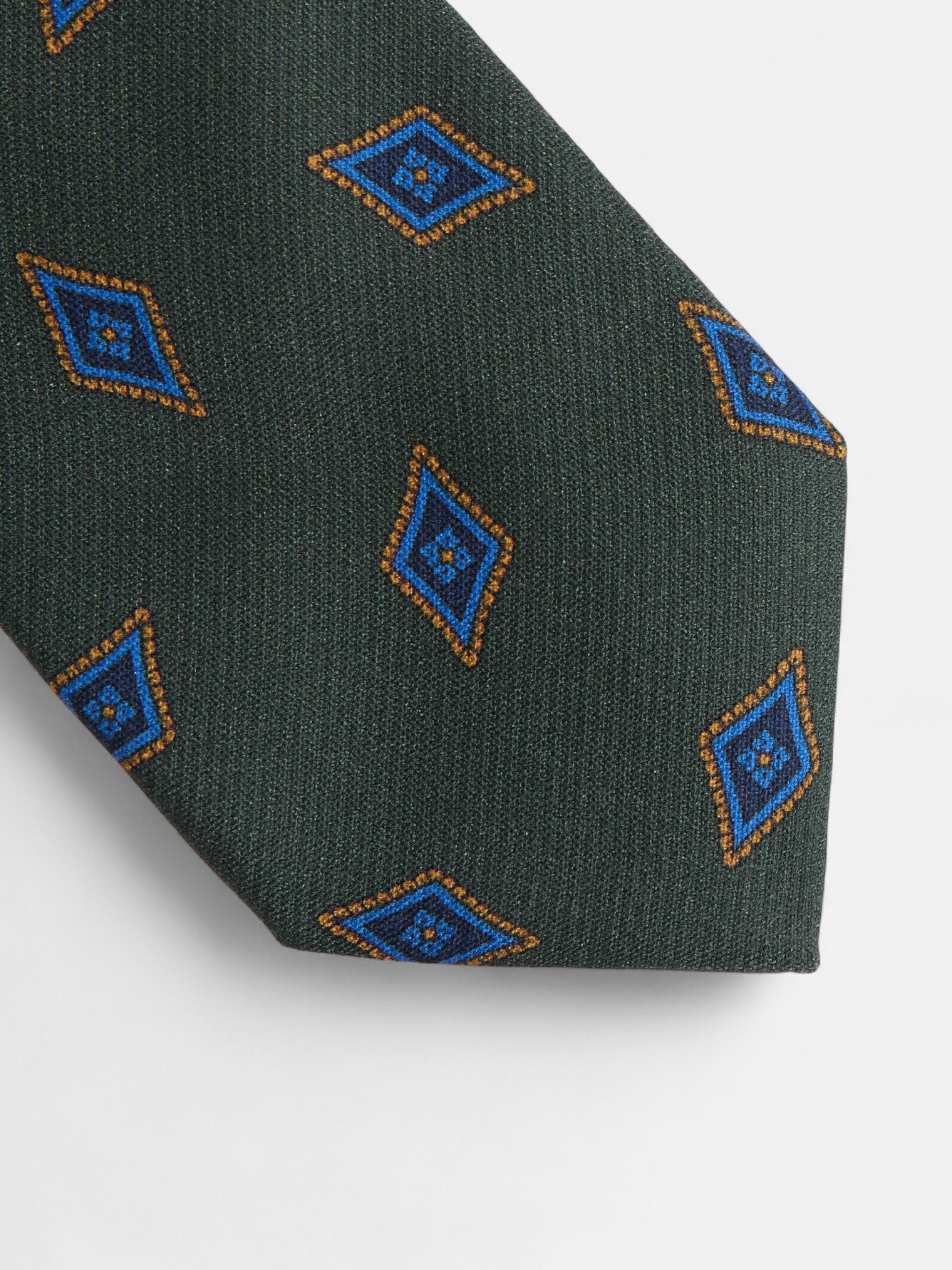 Gravata com padrão de losangos verdes