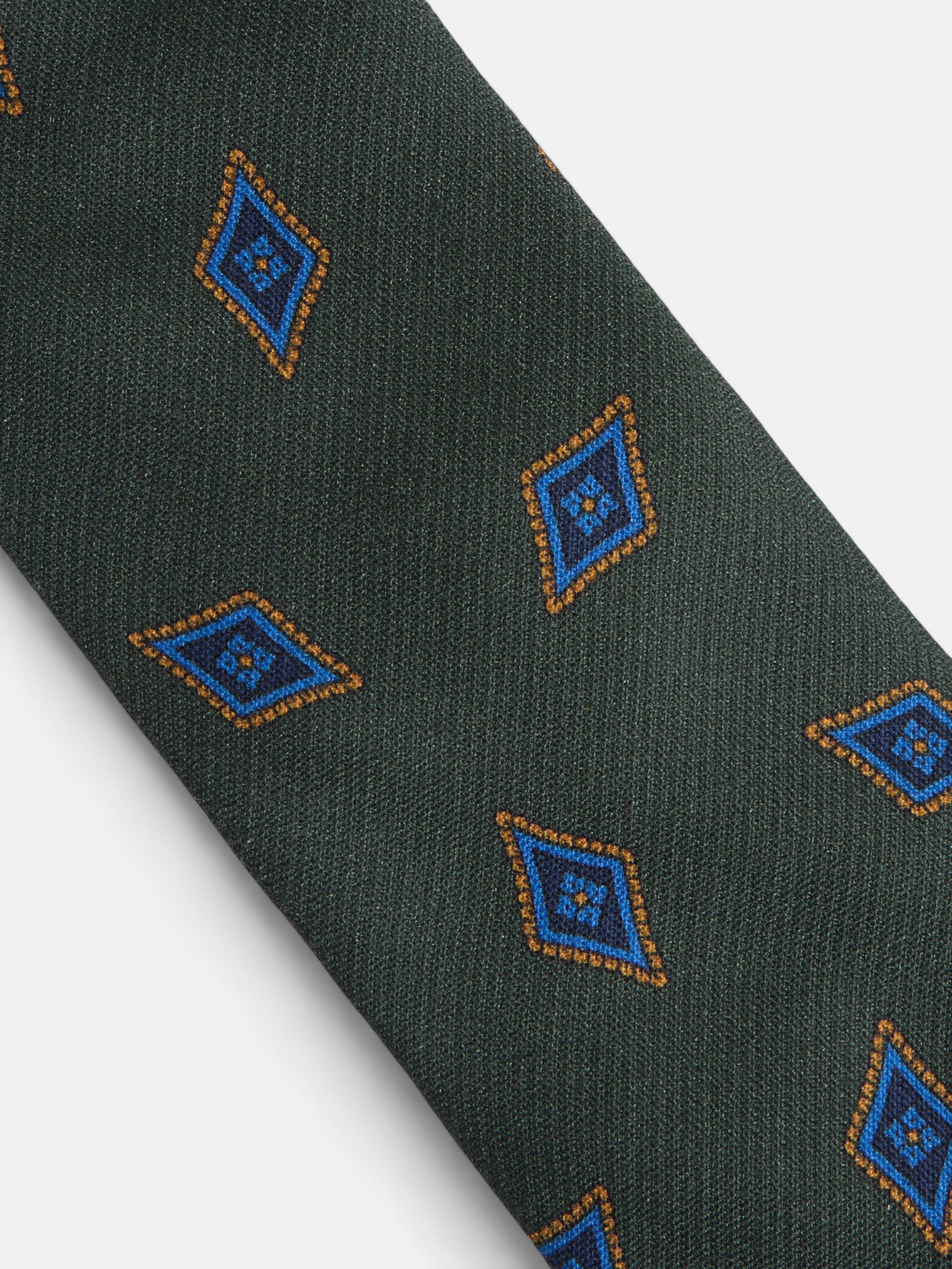 Gravata com padrão de losangos verdes