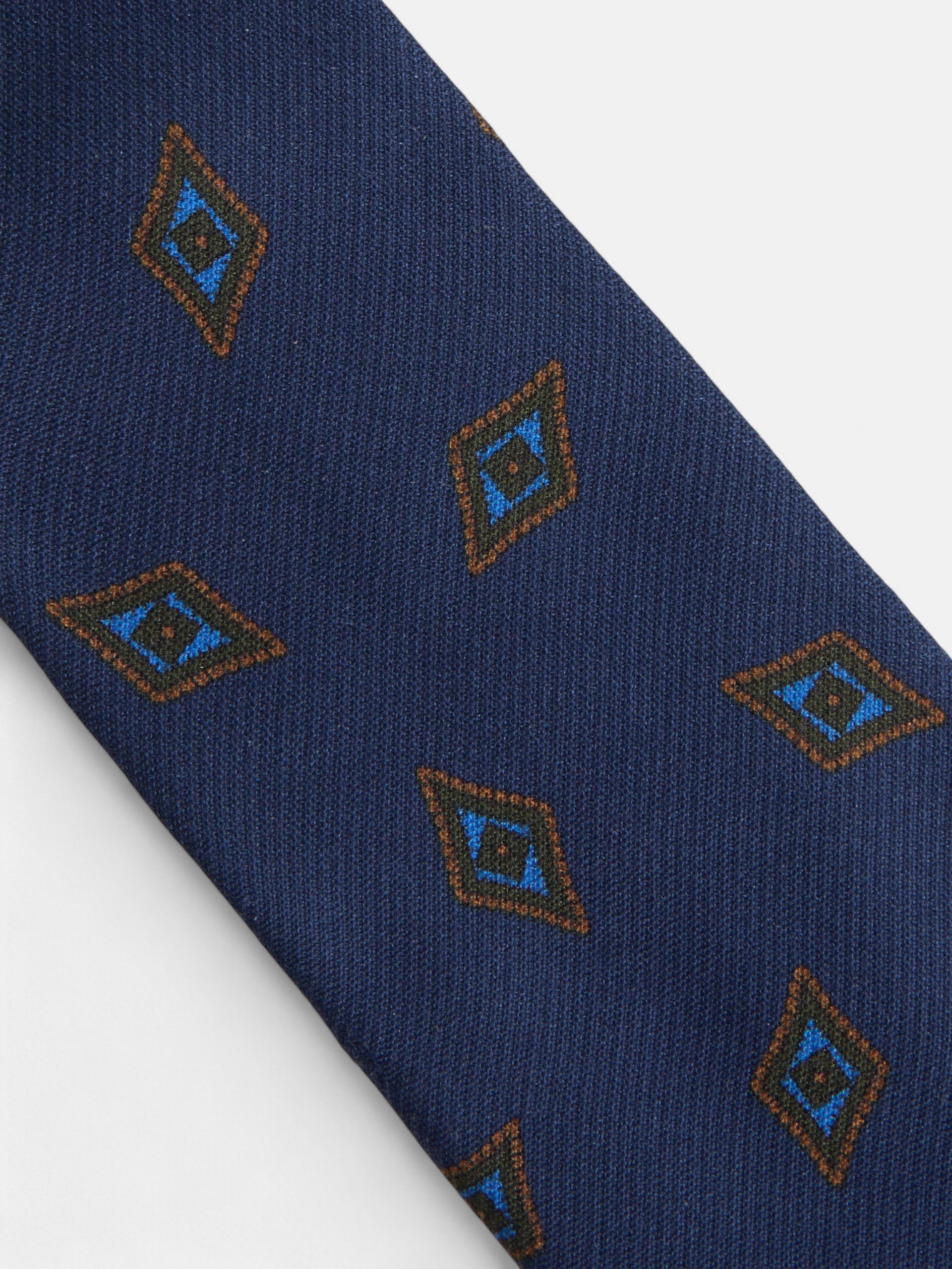 Gravata com padrão de losangos azul-marinho