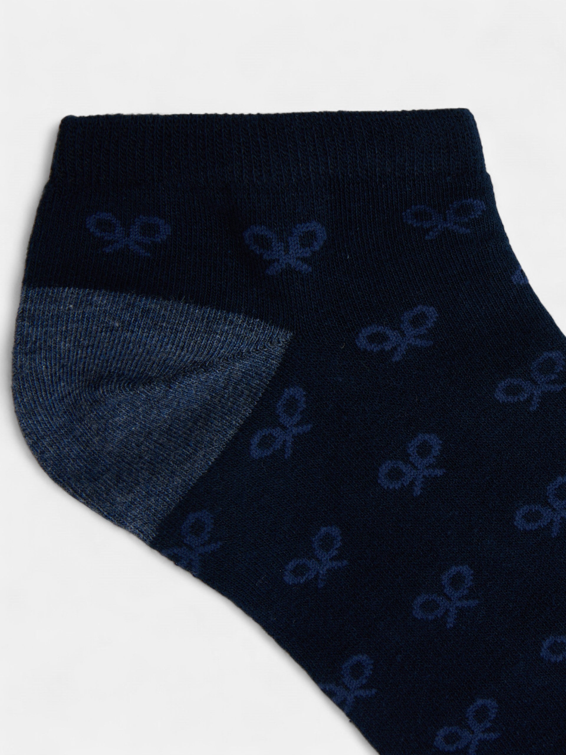 Meia curta azul com múltiplas raquetes