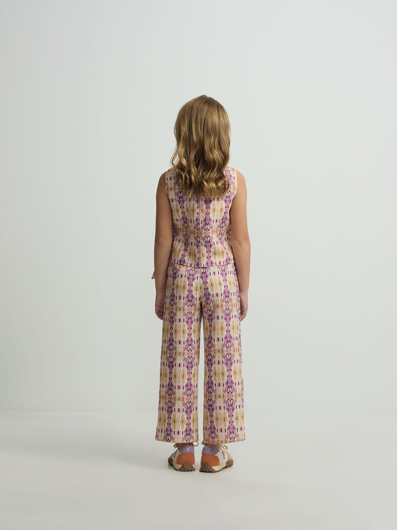 Calças de menina em linho estampado ikat rosas