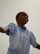 Girl's light blue linen shirt with ruffles