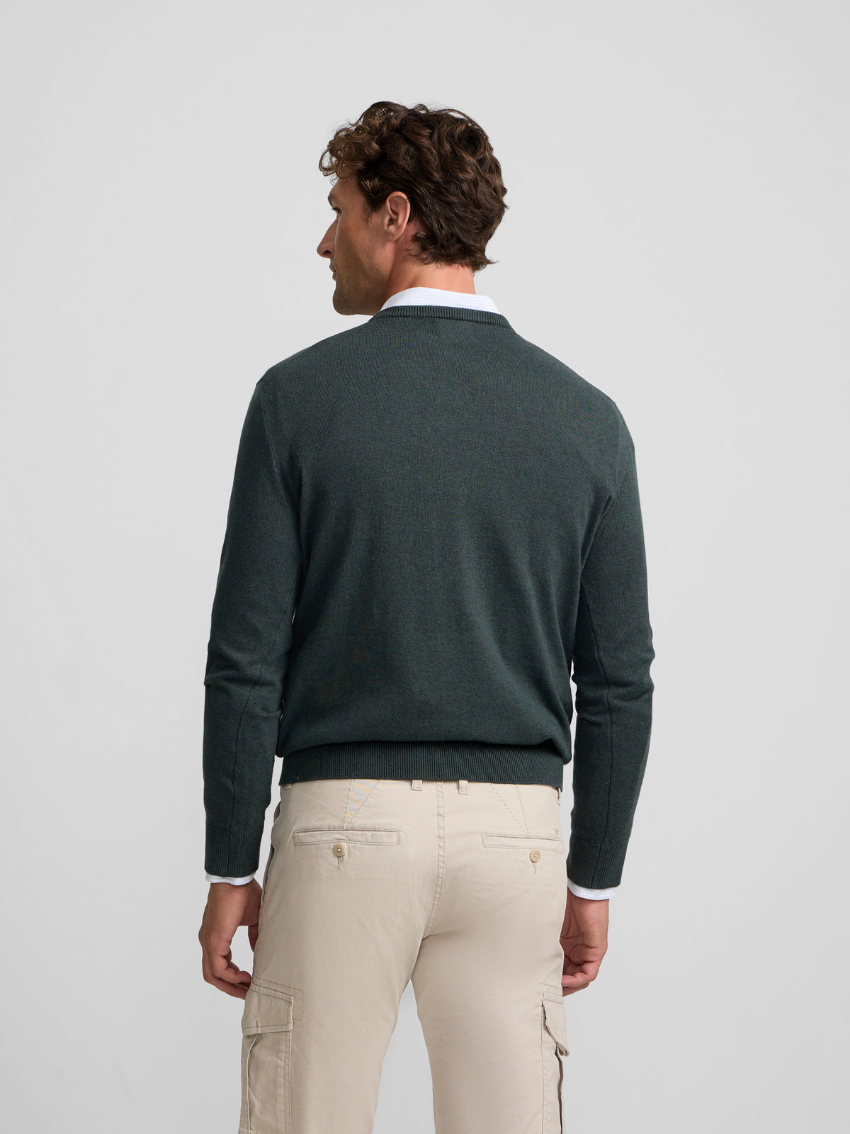 Green V-neck sweater