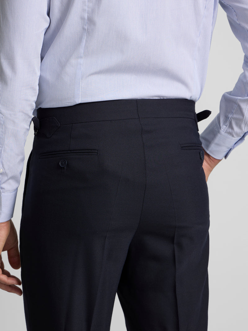 Navy blue pleated dress trousers