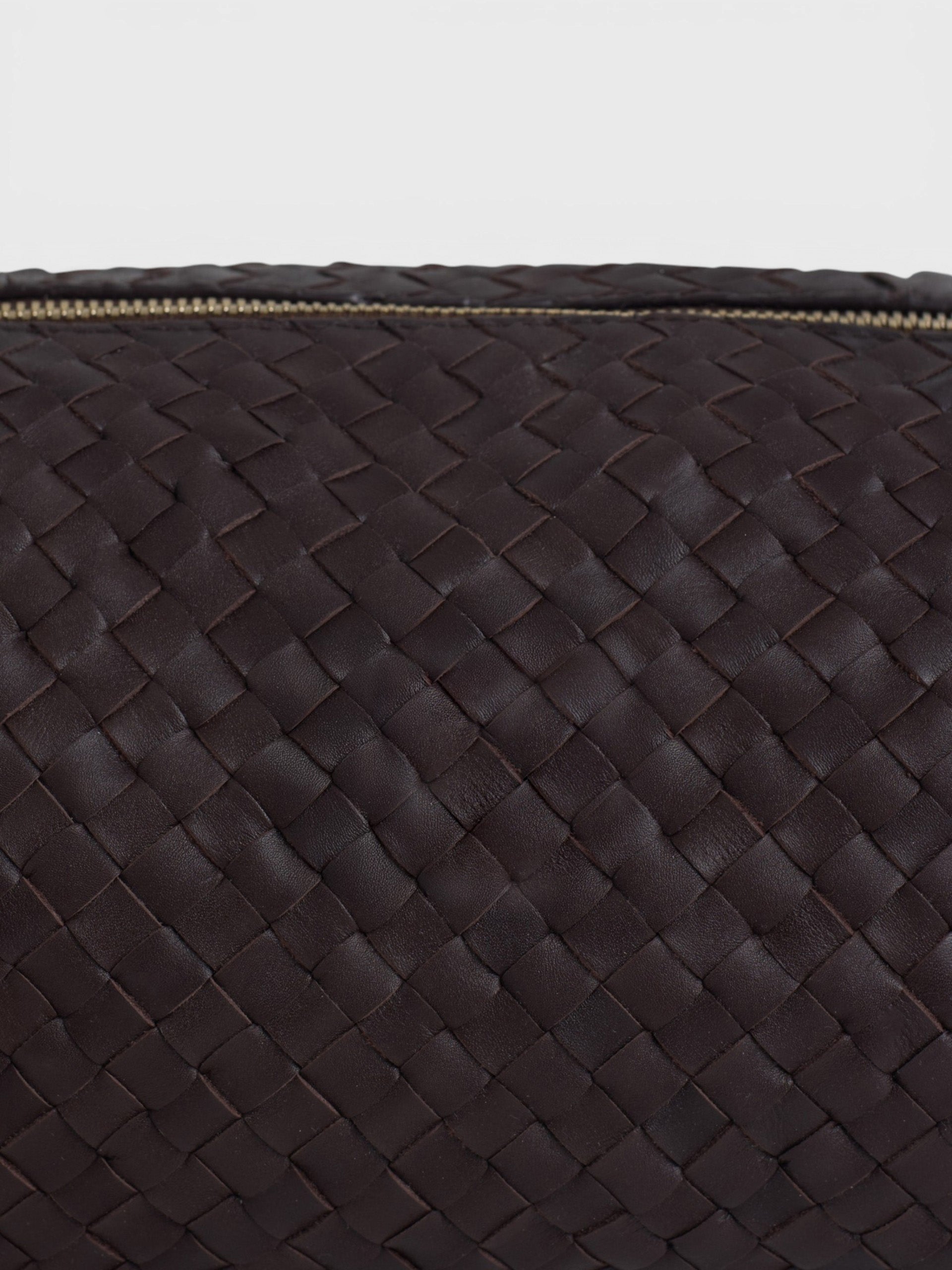 Elongated braided brown leather shoulder bag