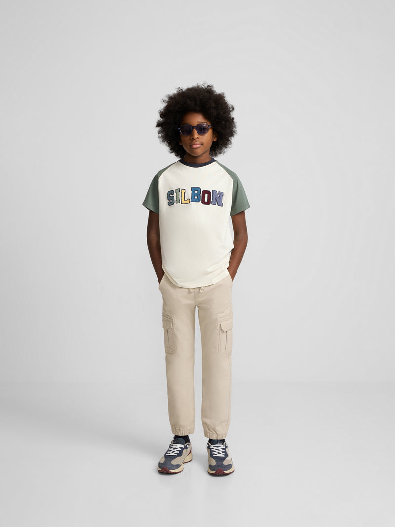 Camiseta kids ranglan varsity verde oscuro