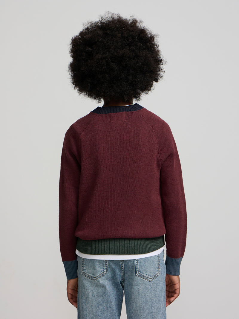 Pull enfant détails couleurs bordeaux