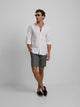 Plain green linen Bermuda shorts