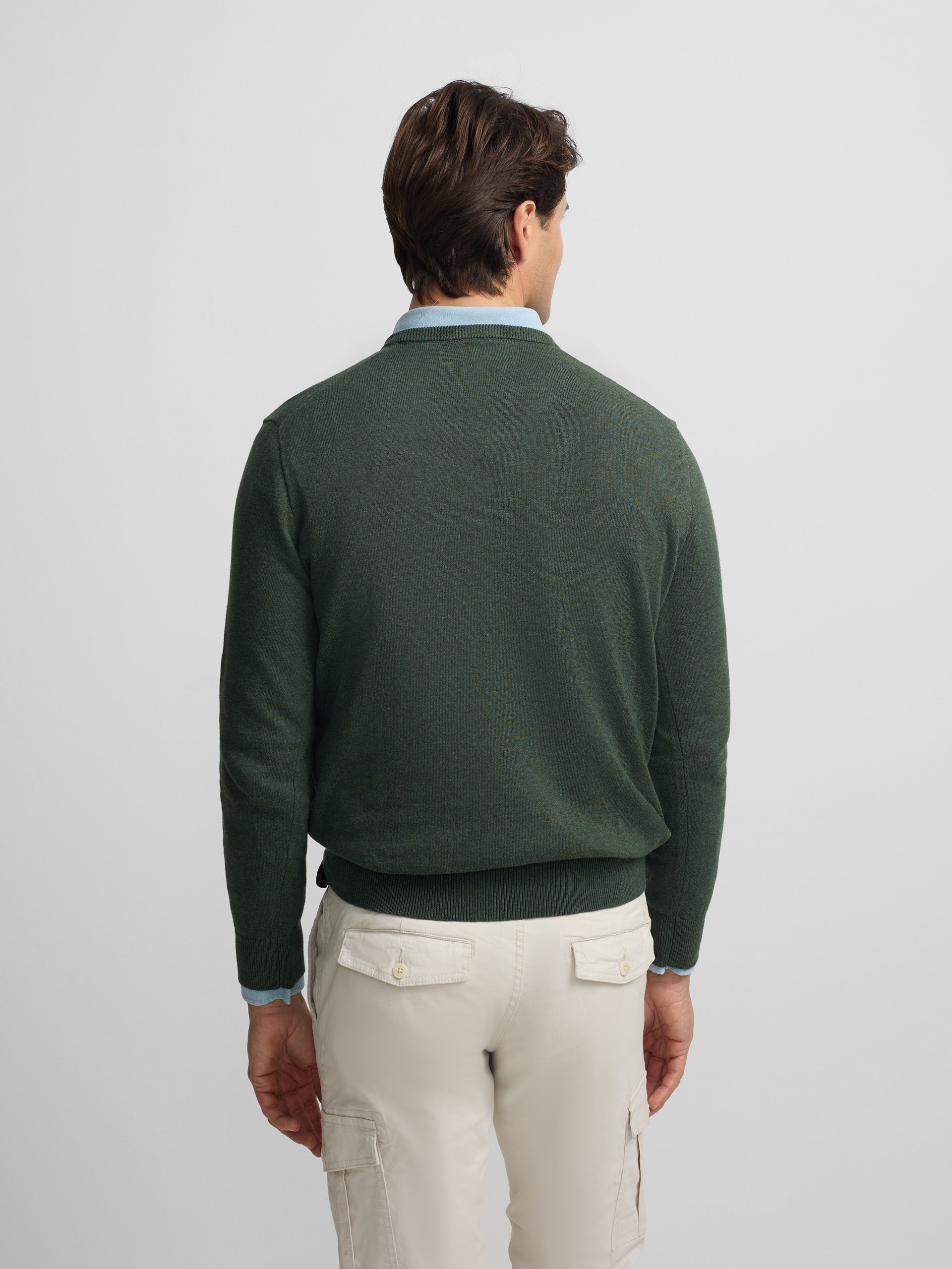 plain dark green V-neck sweater