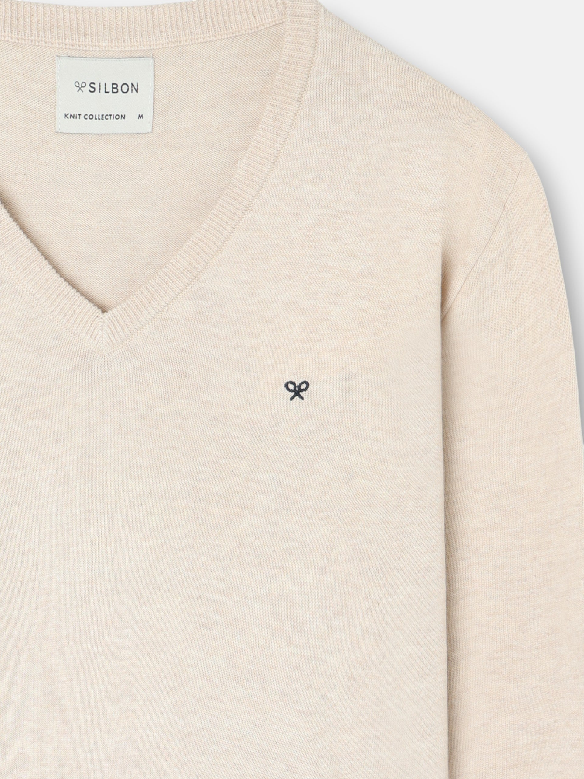 Jersey liso cuello pico crema