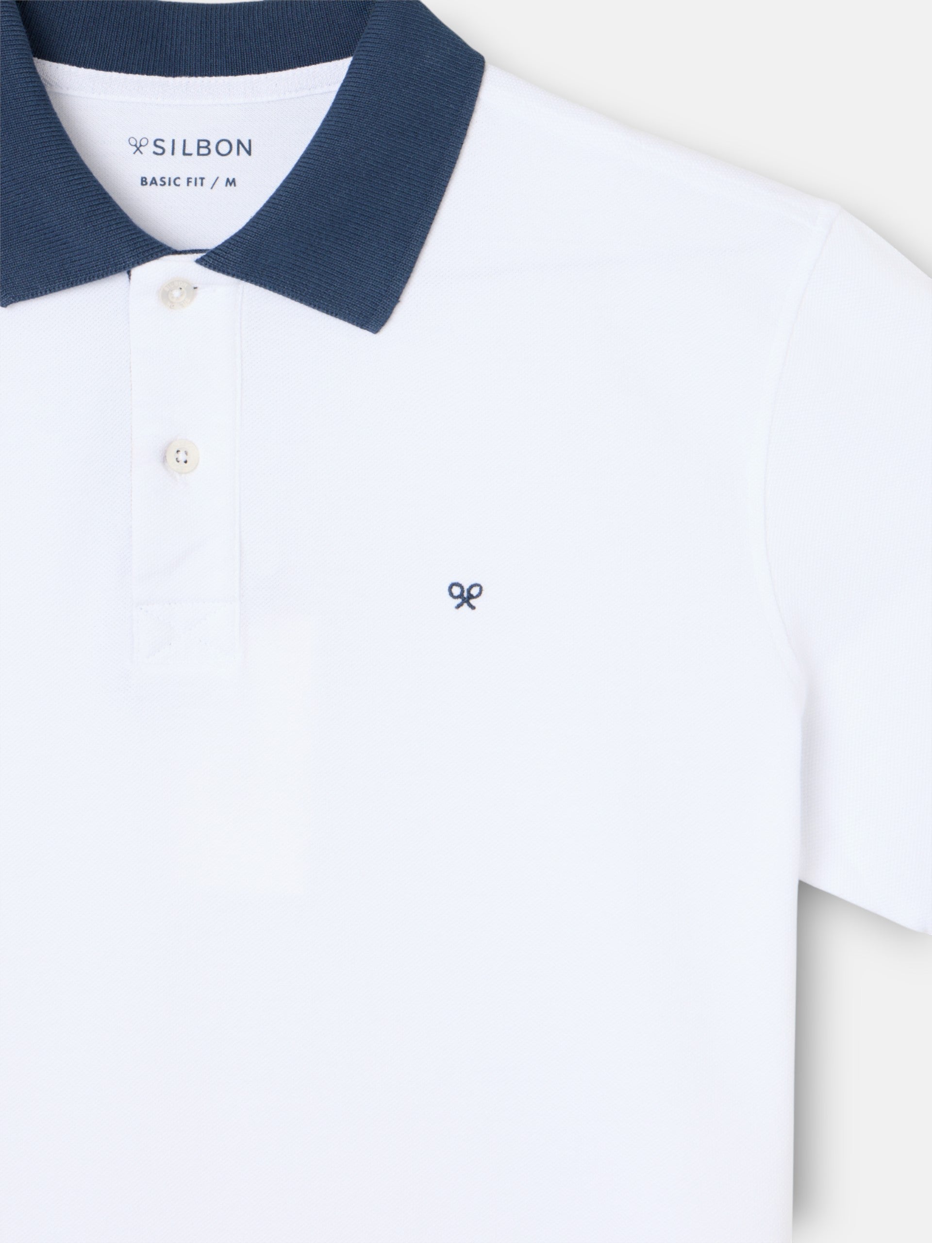 Polo à manches courtes avec finitions bleu marine et blanches