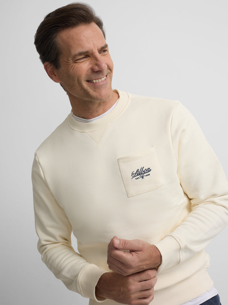 Sudadera bolsillo bordado crema