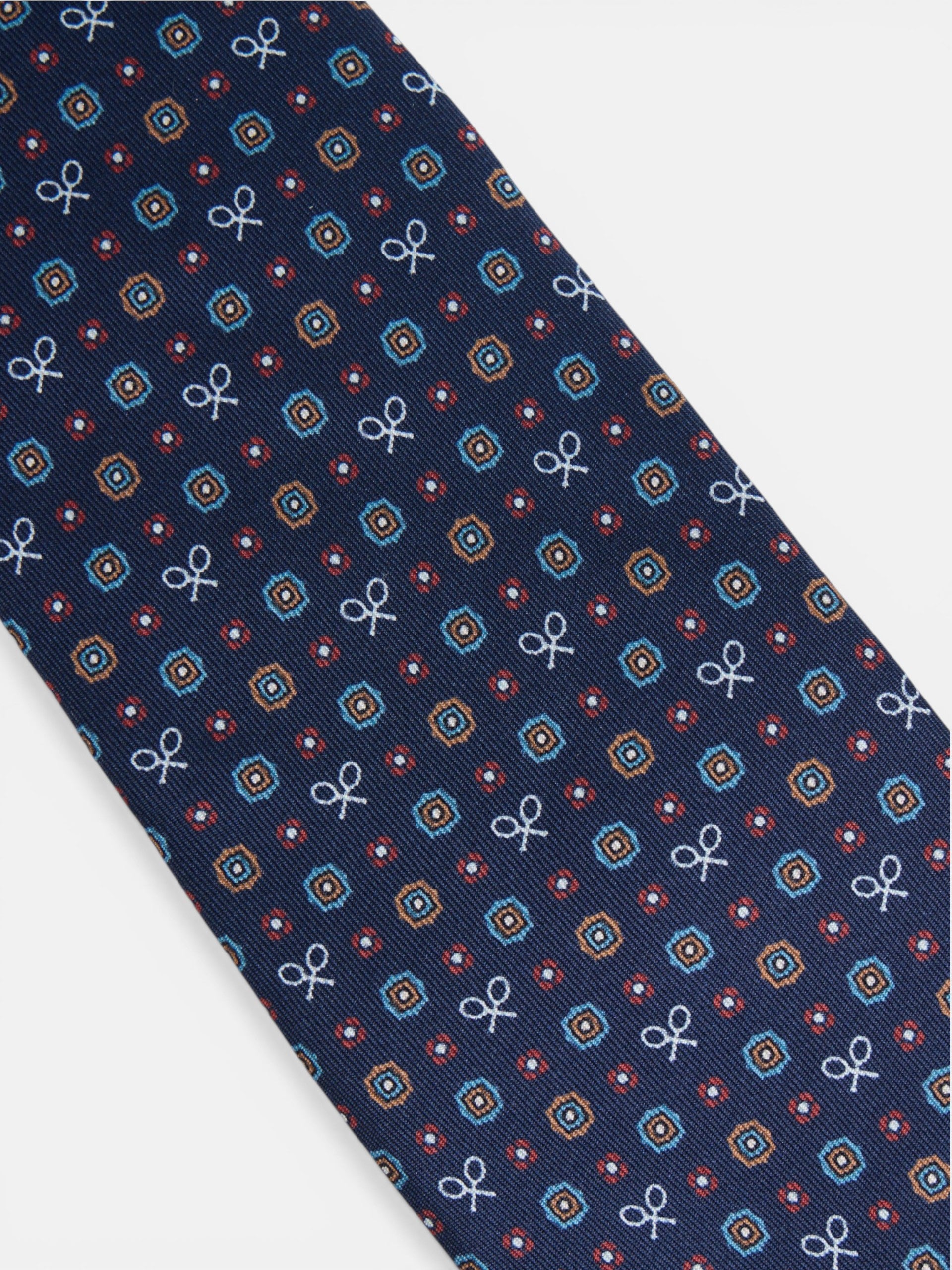 Cravate raquettes motifs géométriques bleu marine