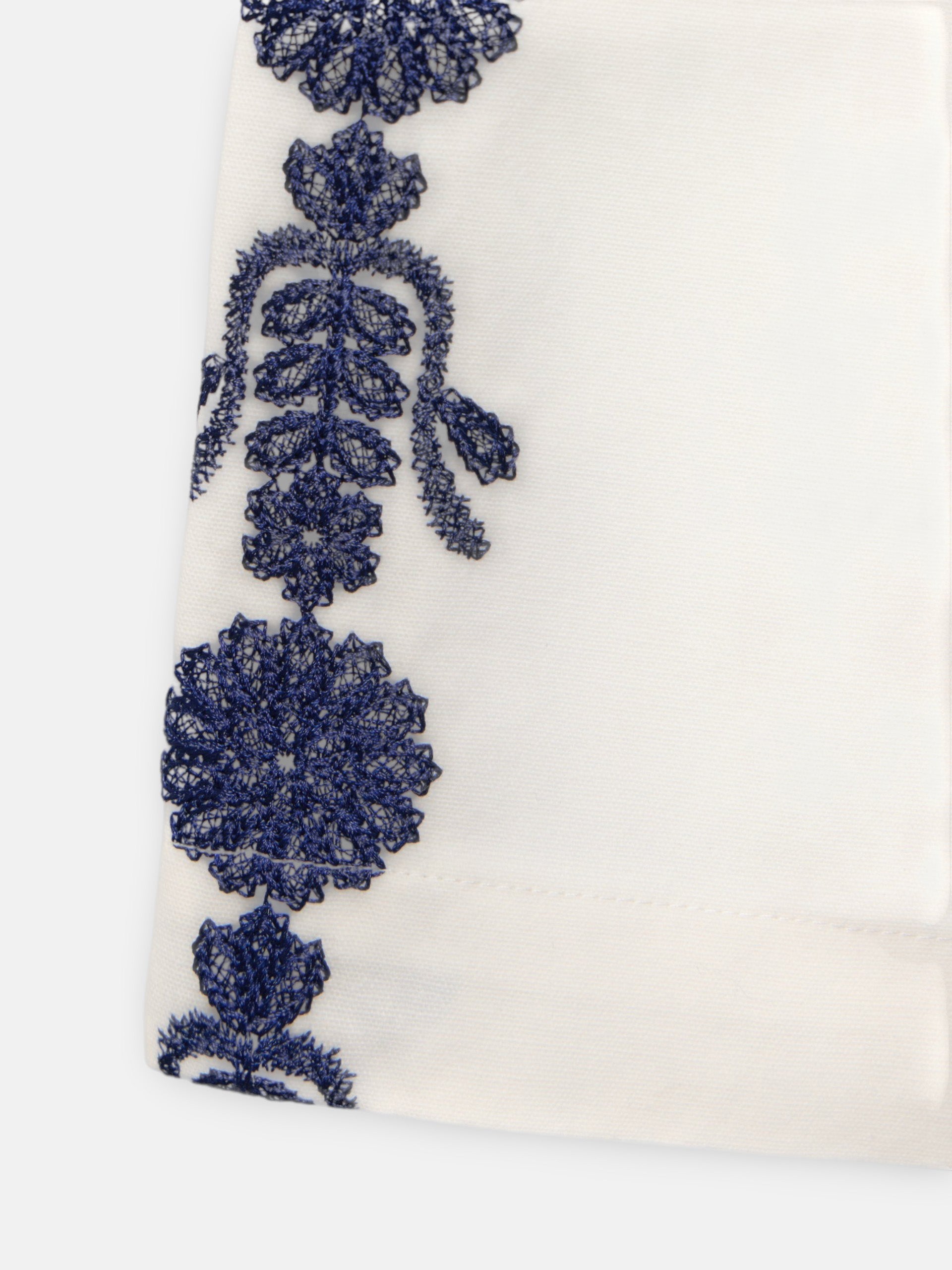 Straight pants with embroidered details in white