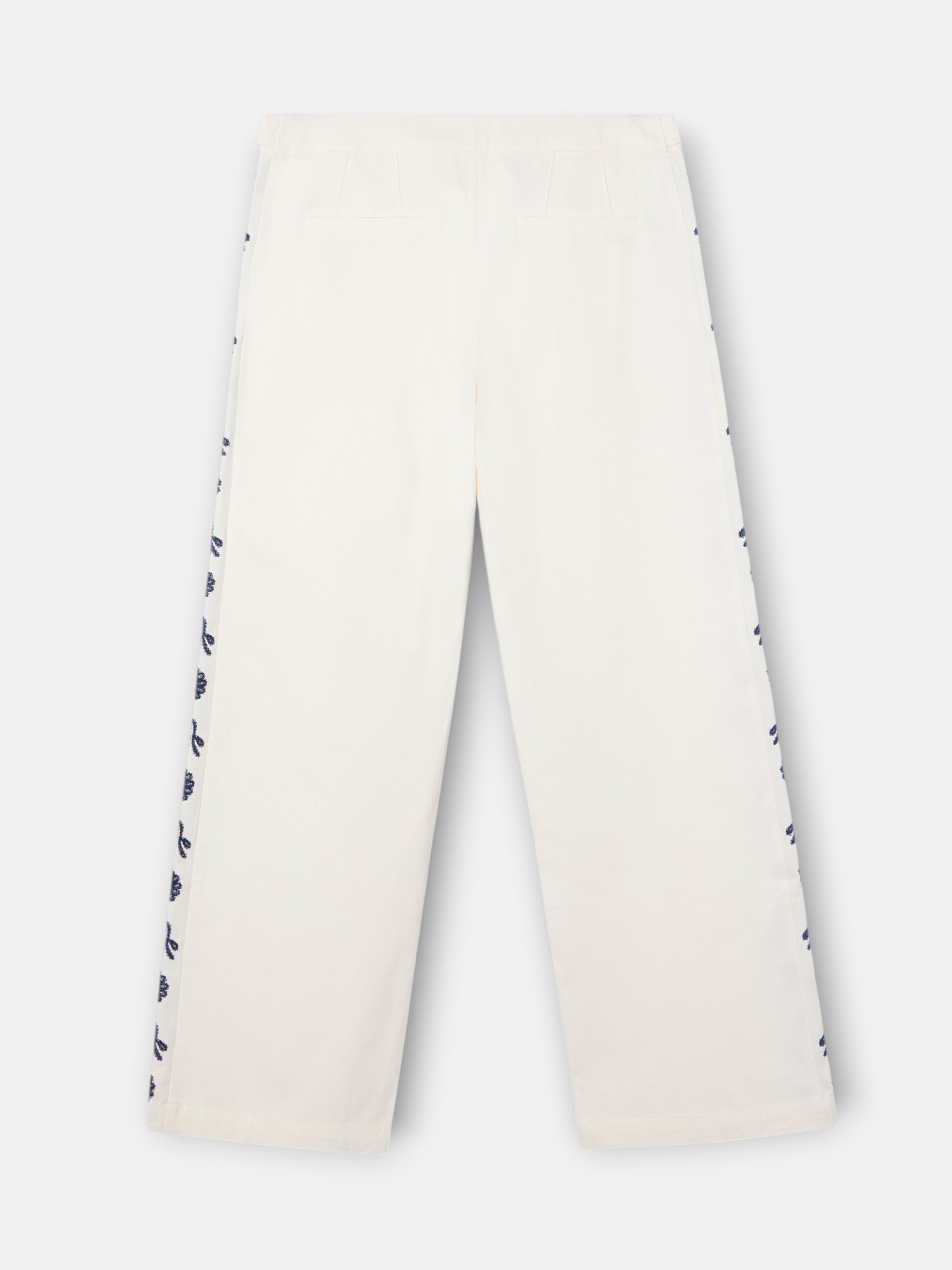 Straight pants with embroidered details in white