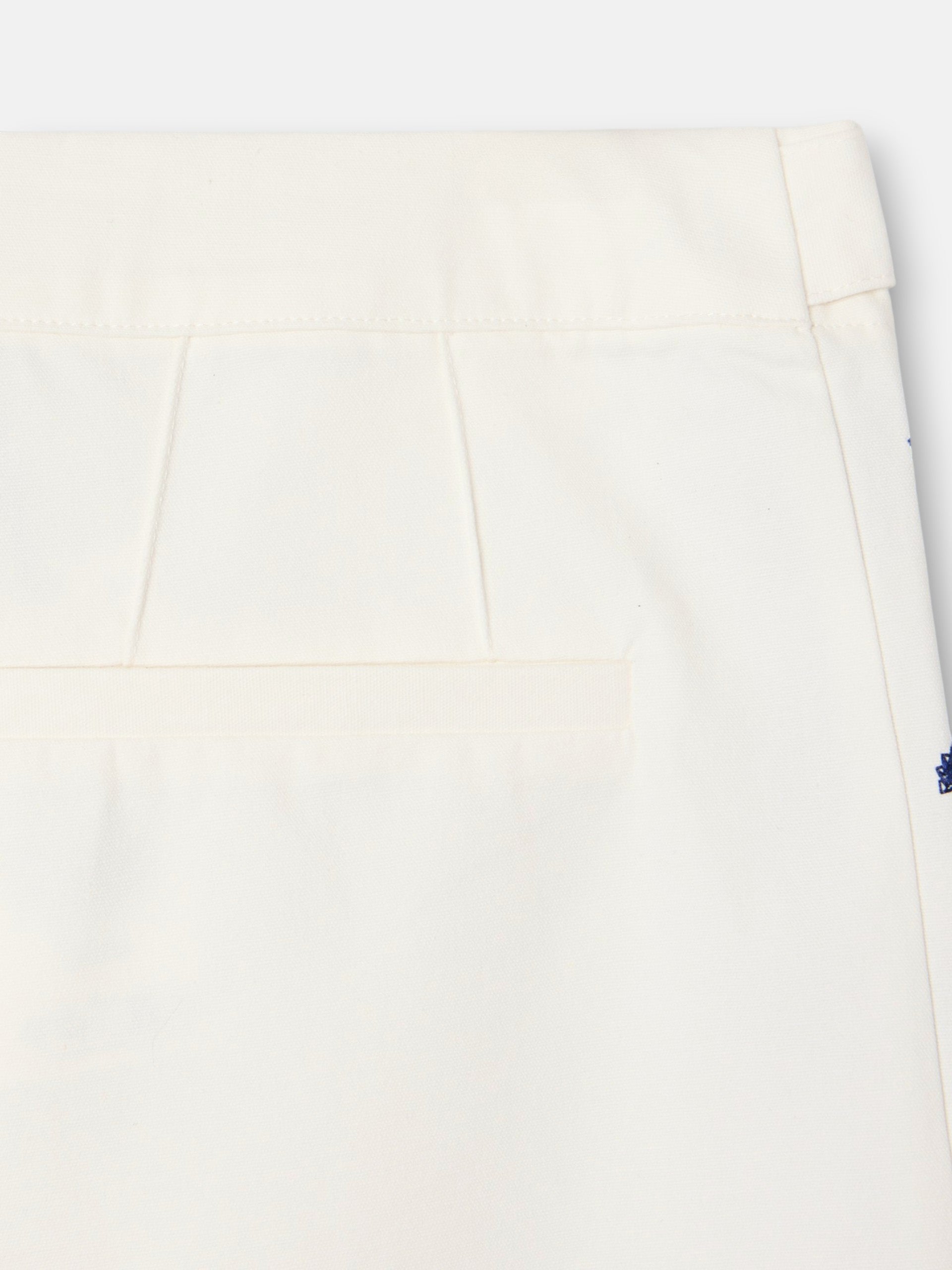 Straight pants with embroidered details in white