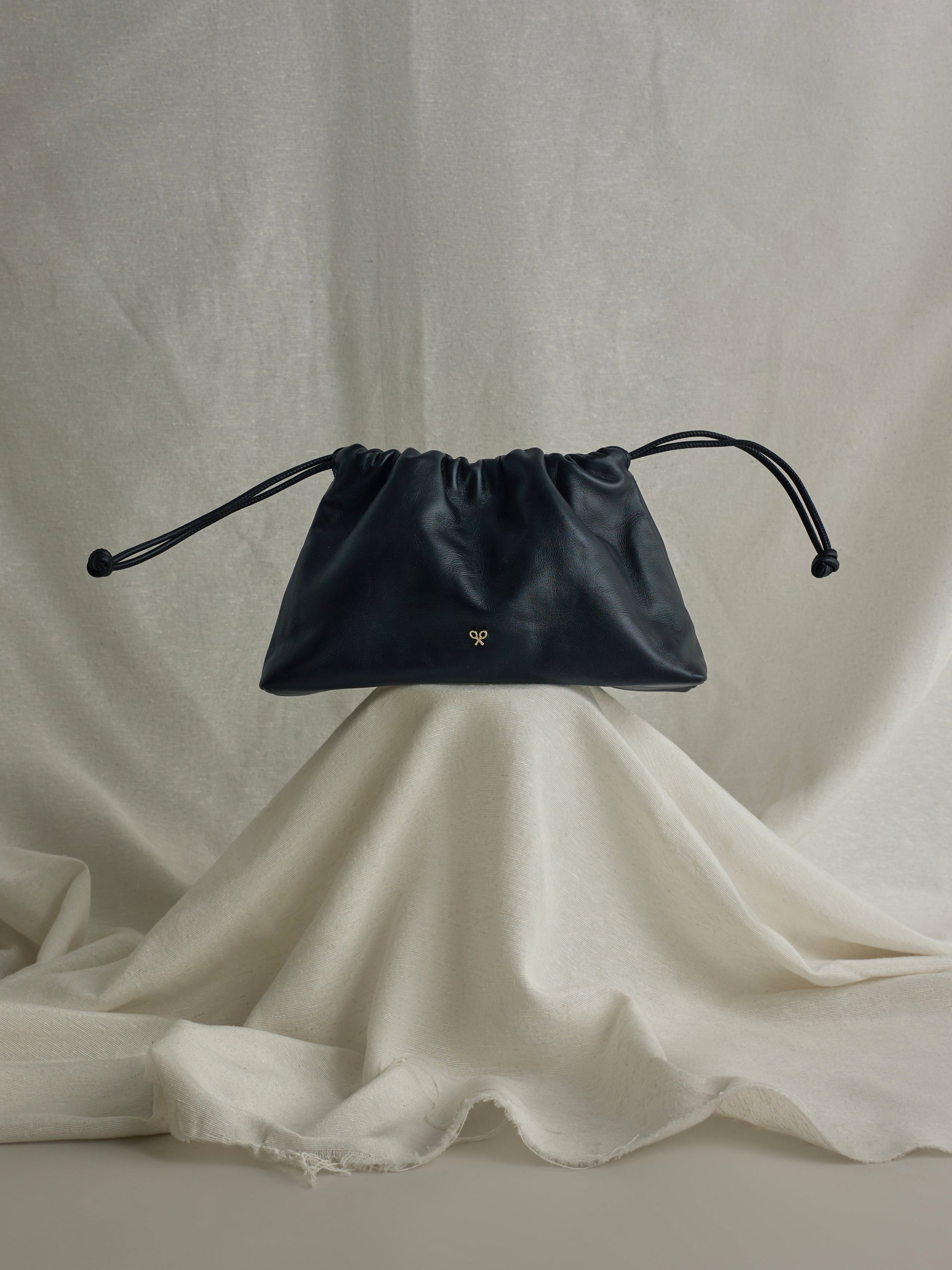 Gathered leather bag with chain detail in black