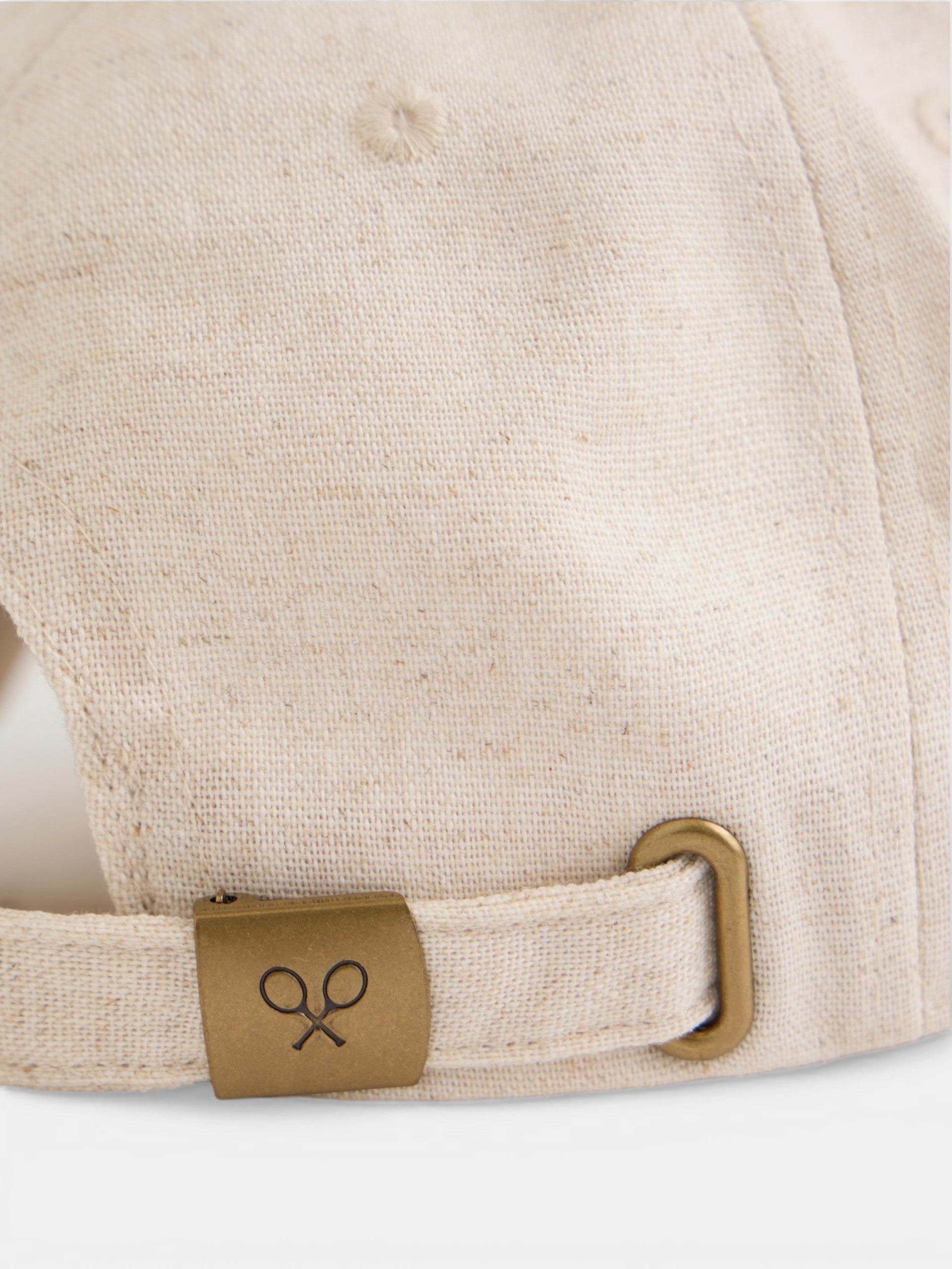 Beige cap with ethnic motif