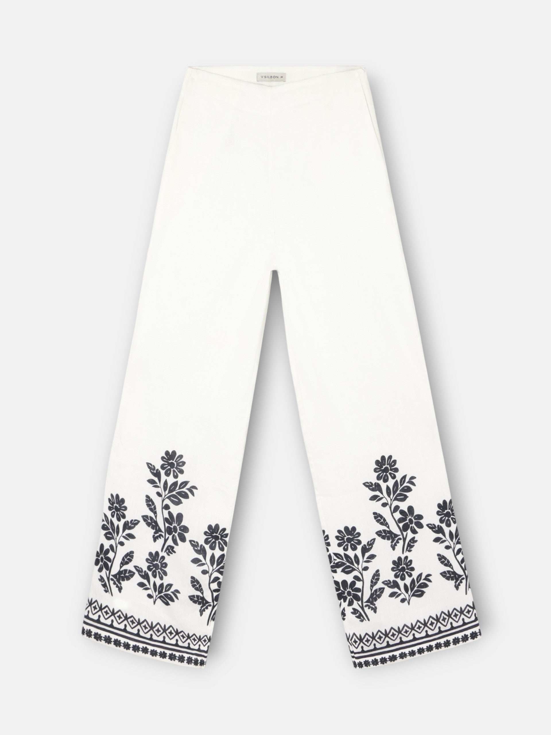 Calças estampadas com flores brancas