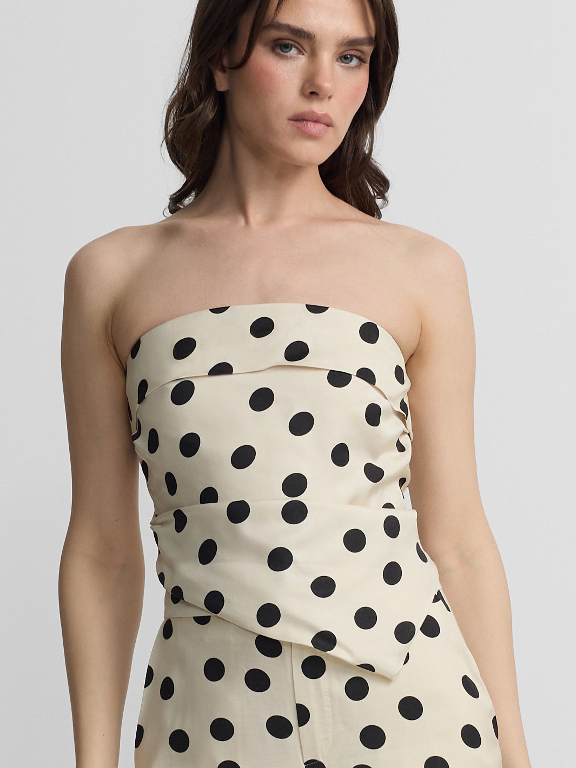 White and black polka dot strapless top