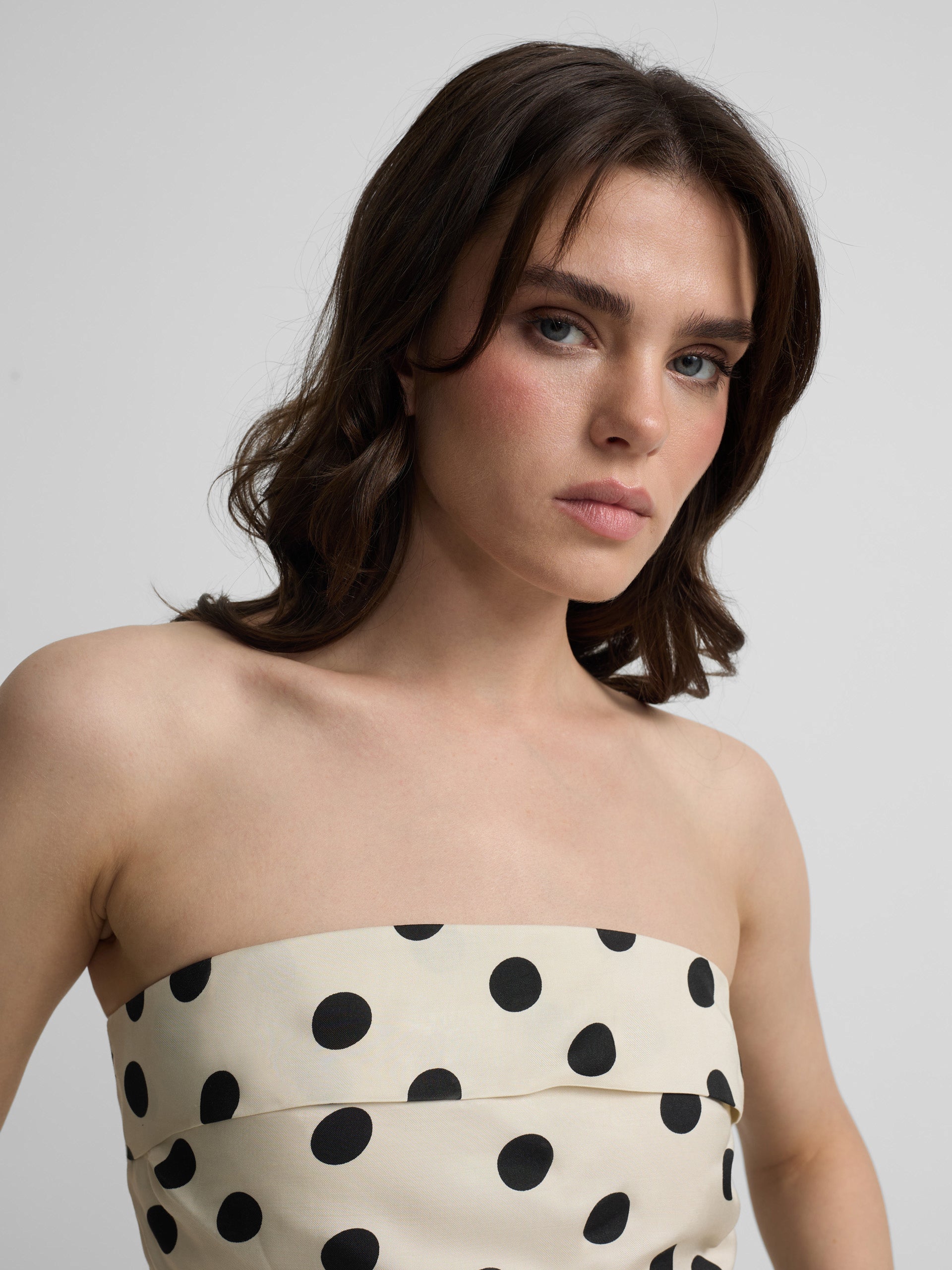 White and black polka dot strapless top