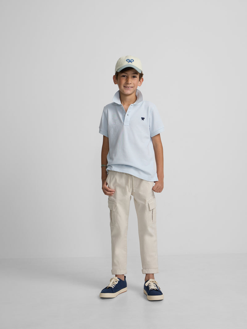 Polo criança liso com logótipo em felpo azul claro