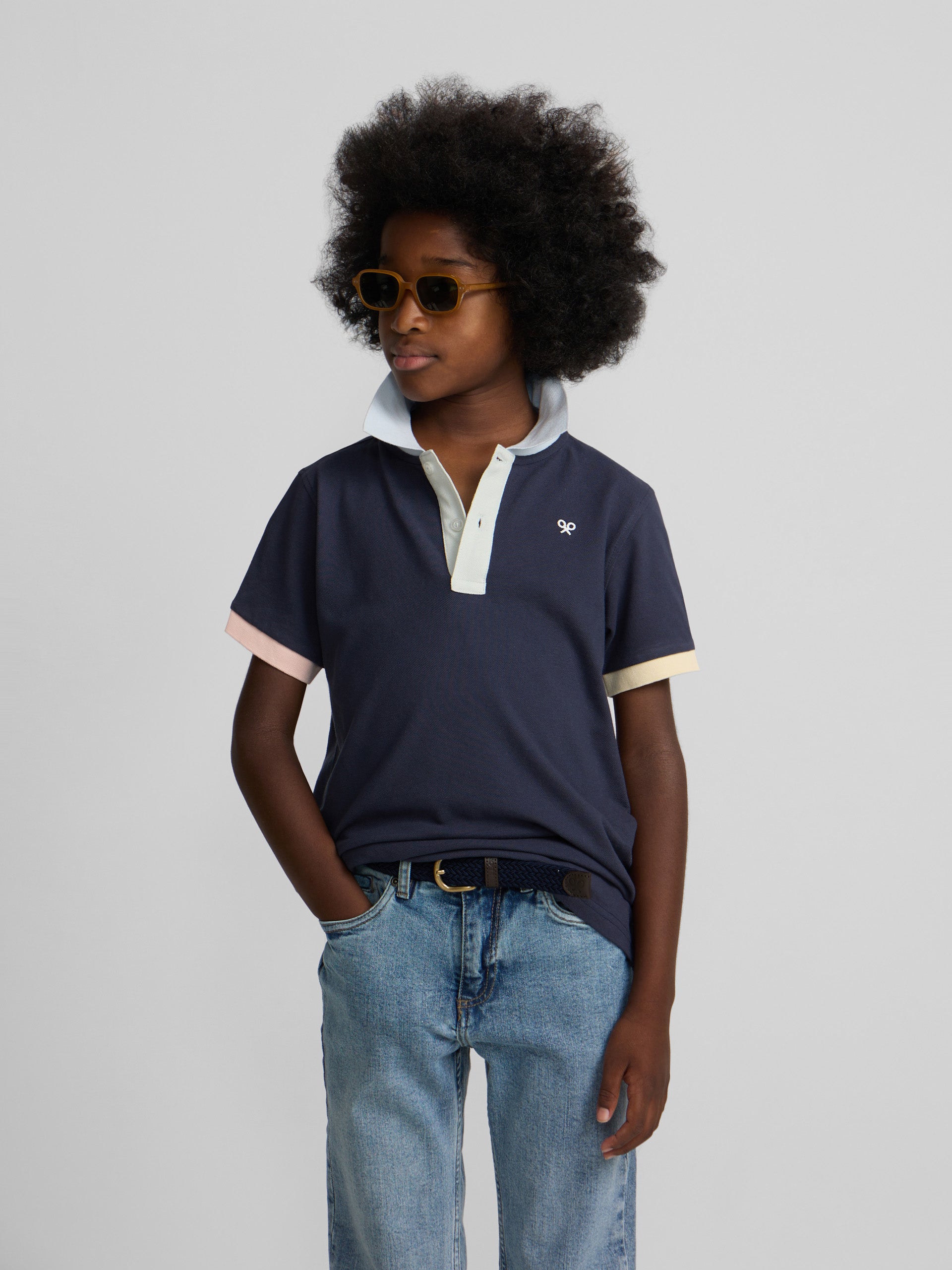 Navy blue kids polo with multicolor trim