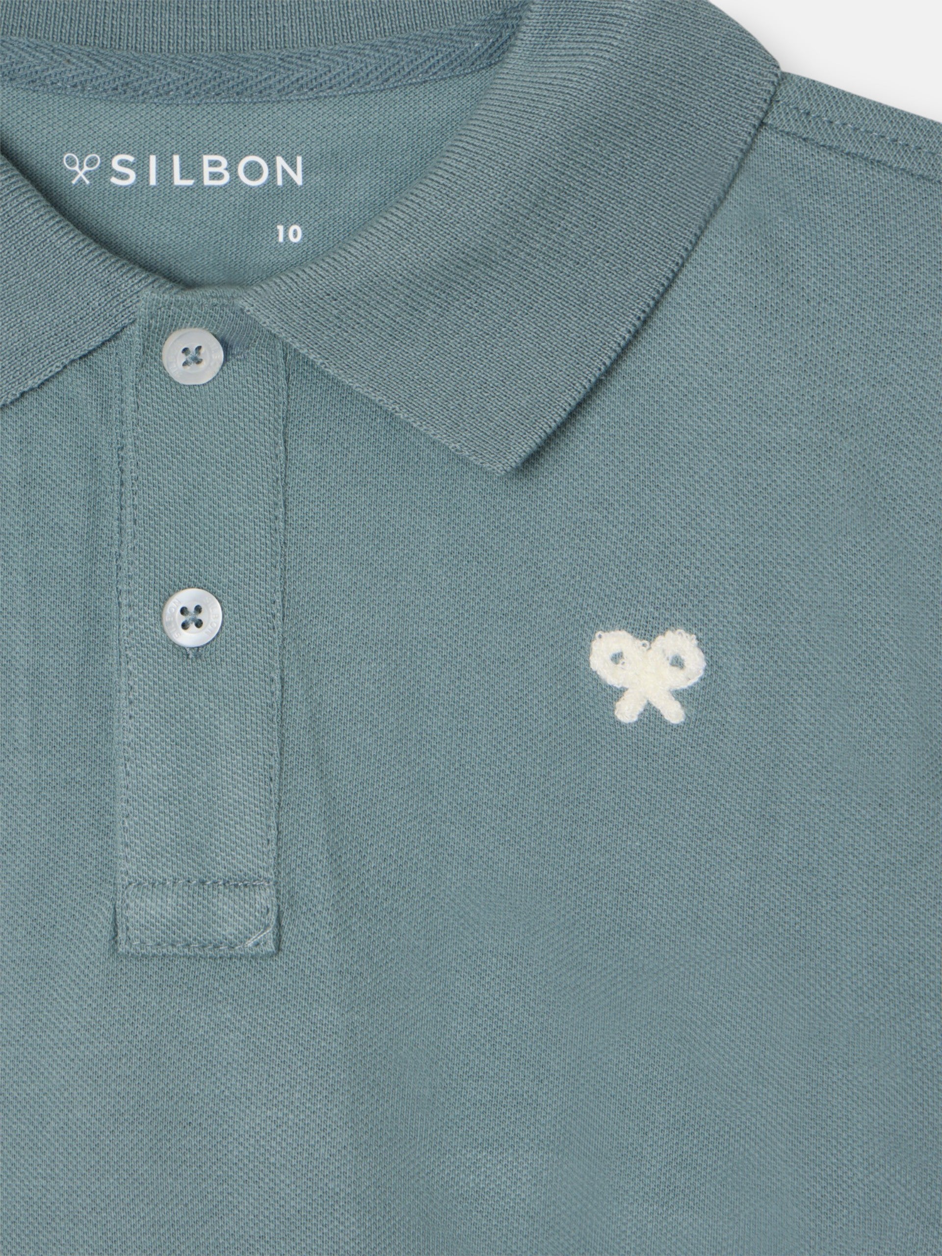 Polo kids liso logo rizo verde oscuro