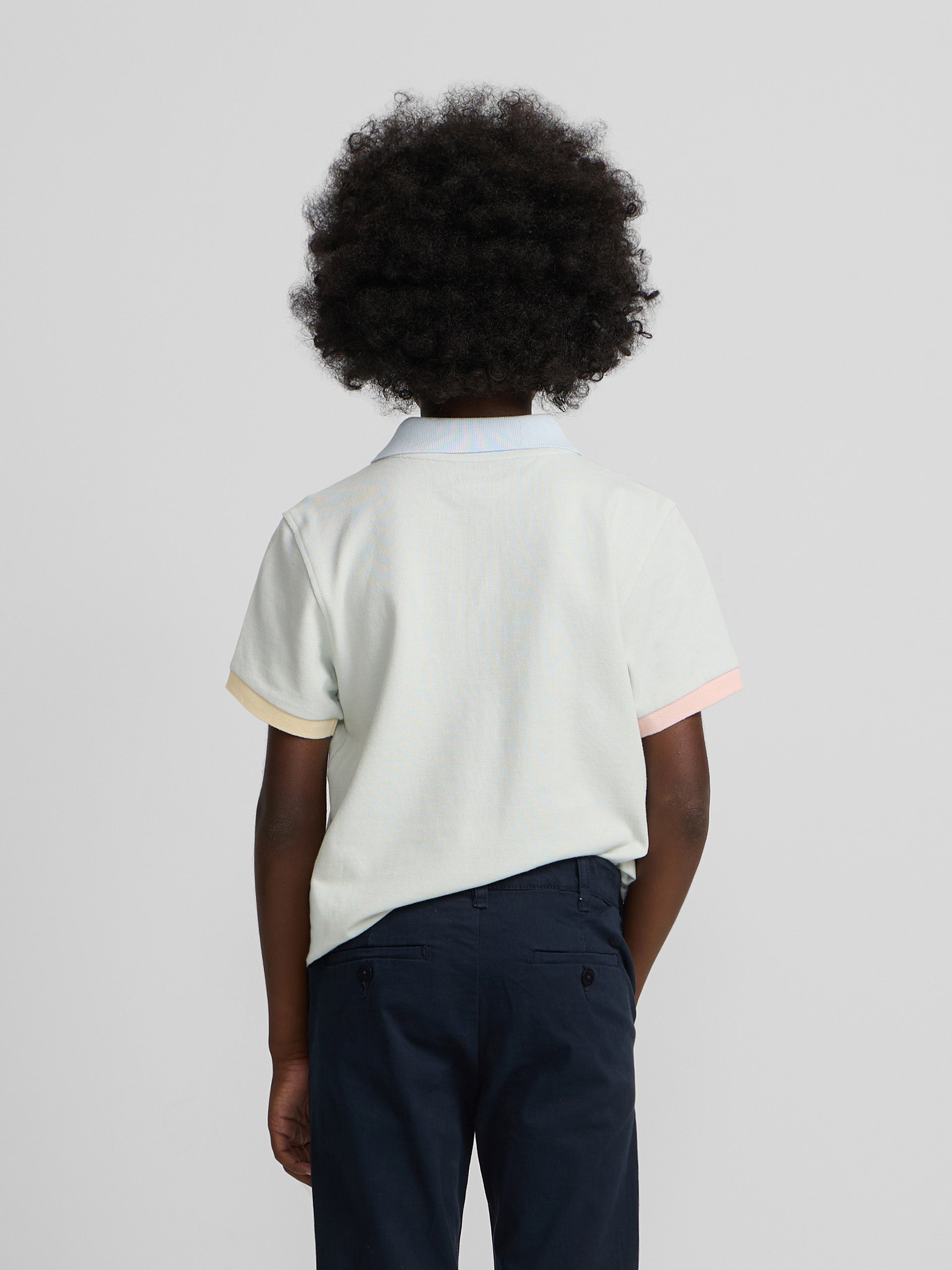 Light green kids' polo with multicolor trim
