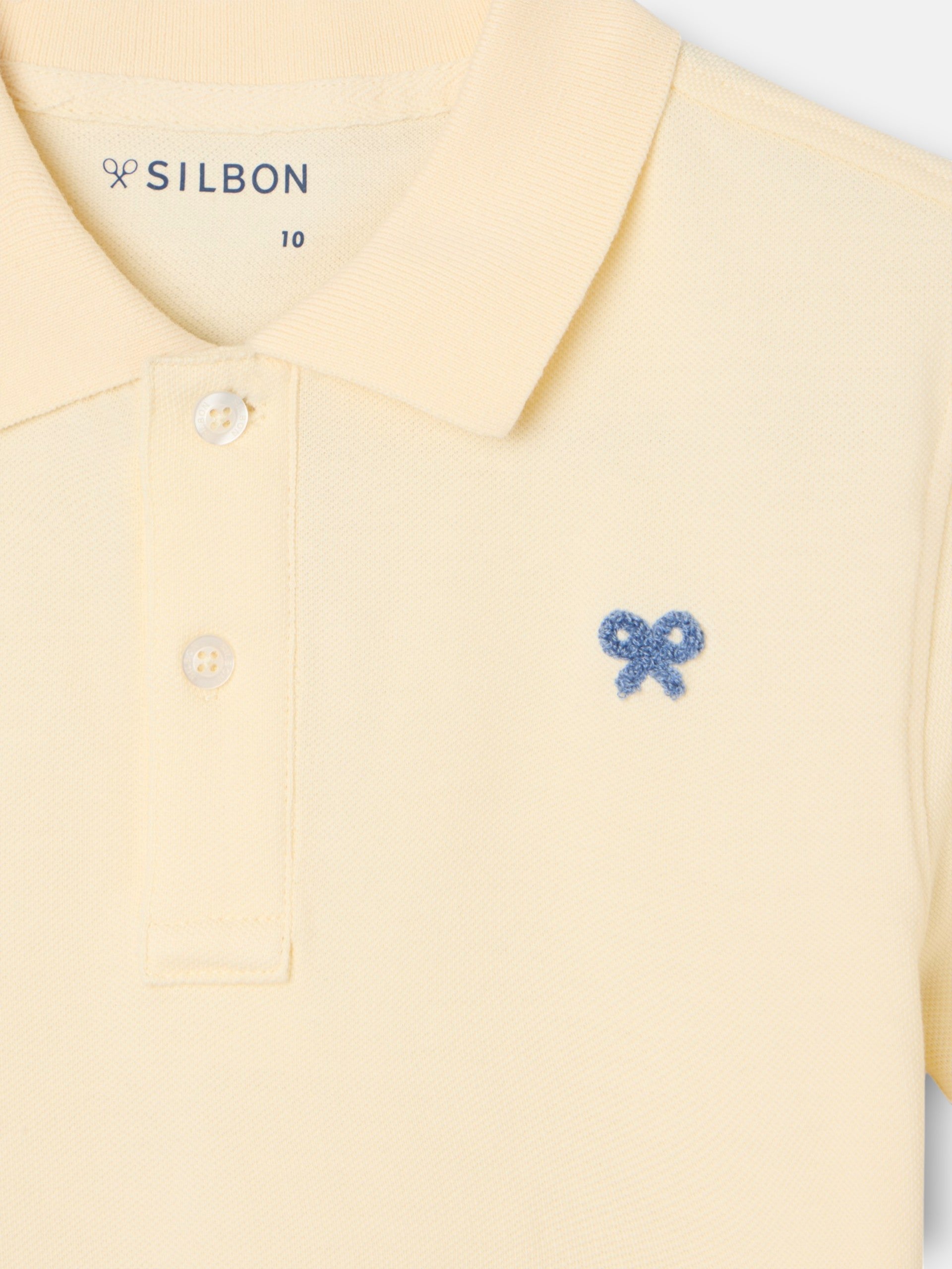 Polo kids liso logo rizo amarillo