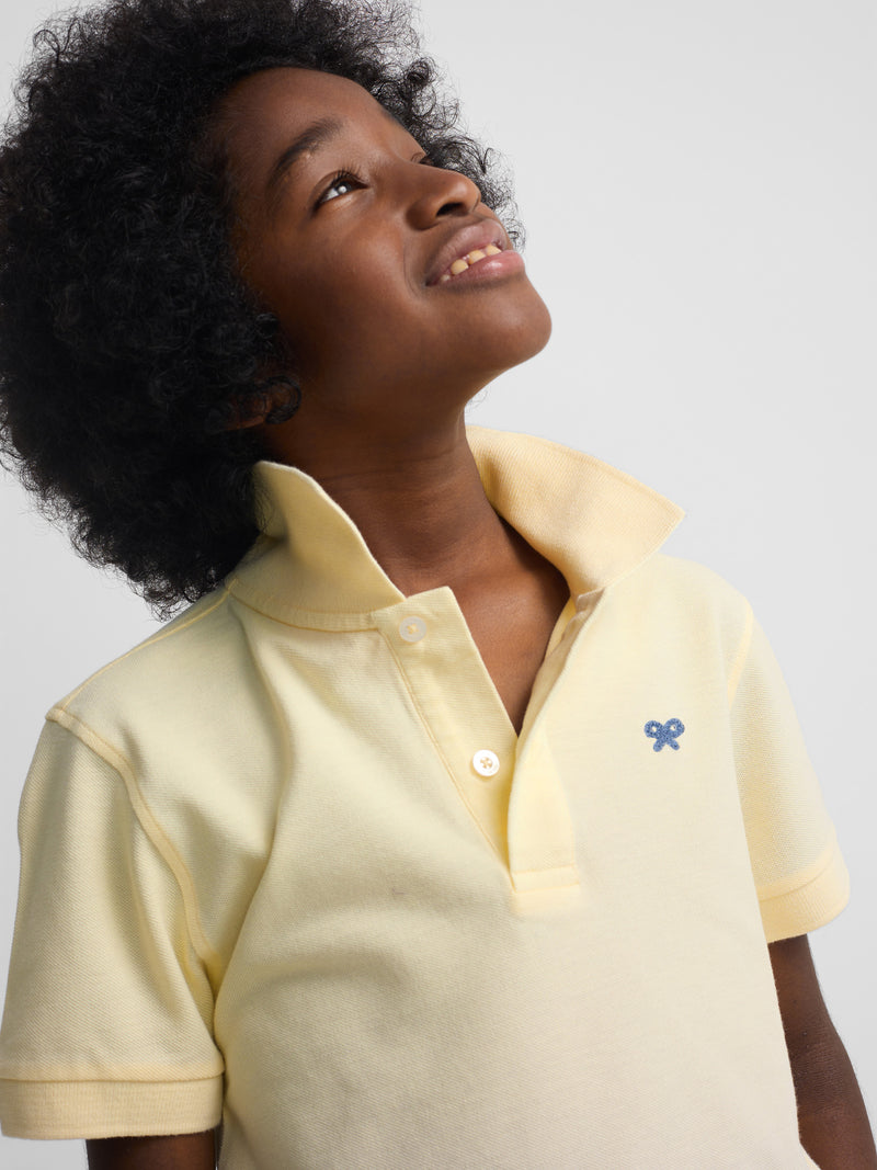 Polo kids liso logo rizo amarillo