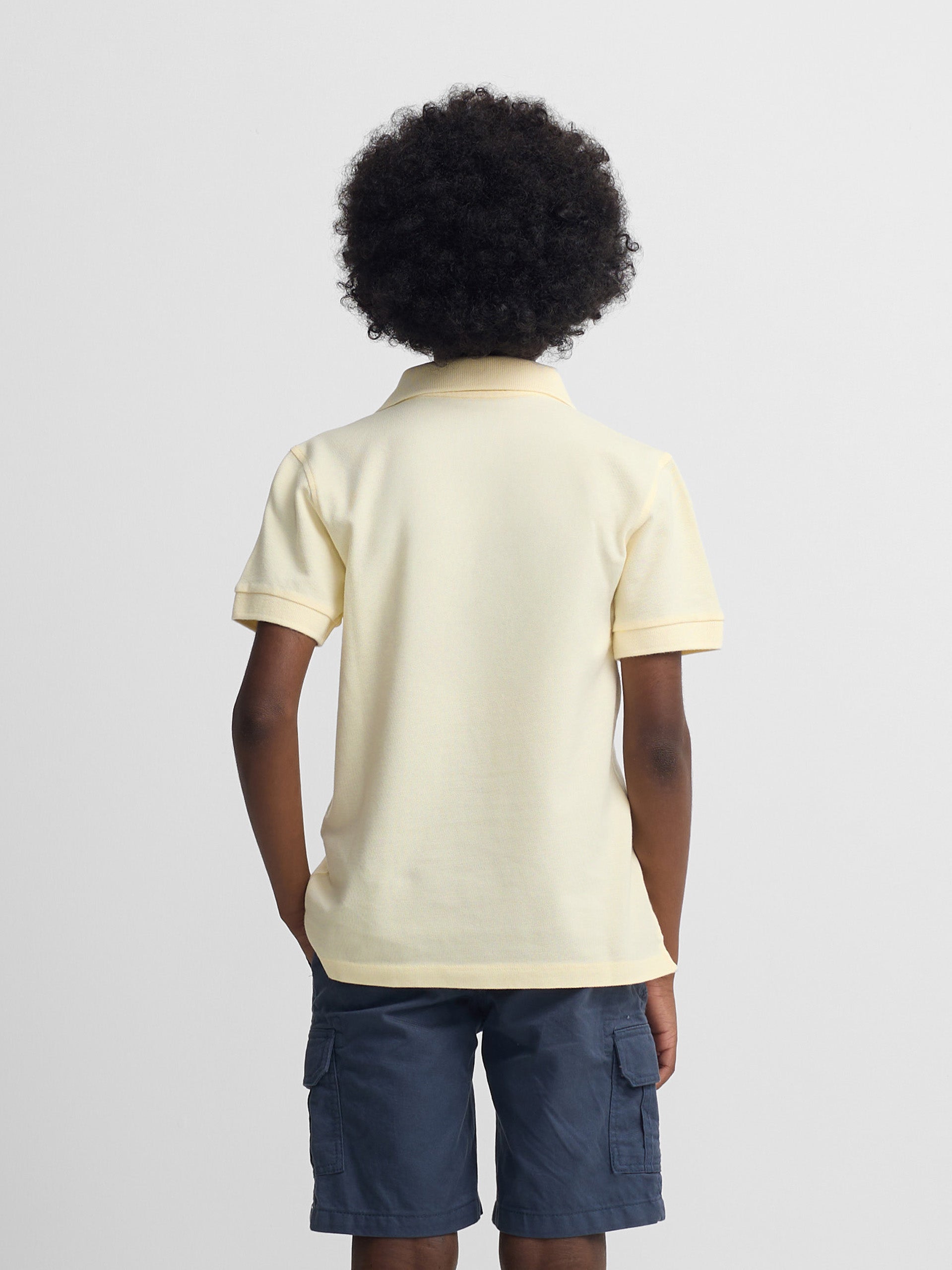 Plain kids polo with terry logo in yellow