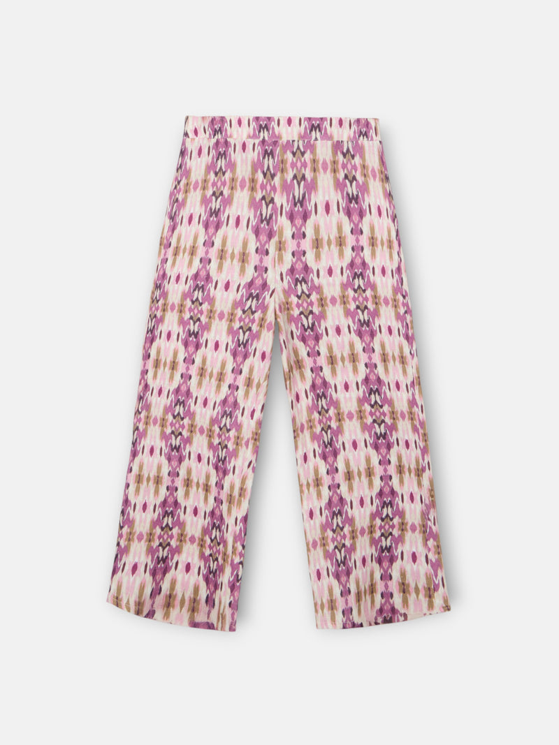 Calças de menina em linho estampado ikat rosas