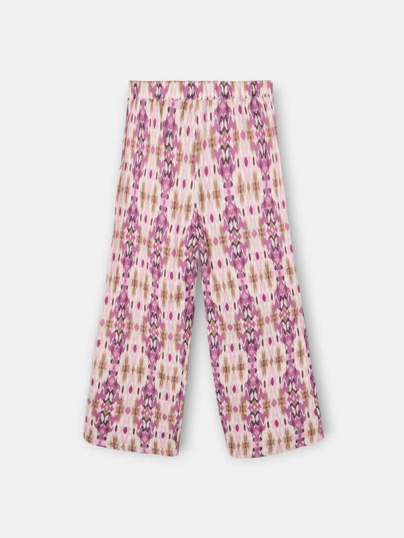 Calças de menina em linho estampado ikat rosas