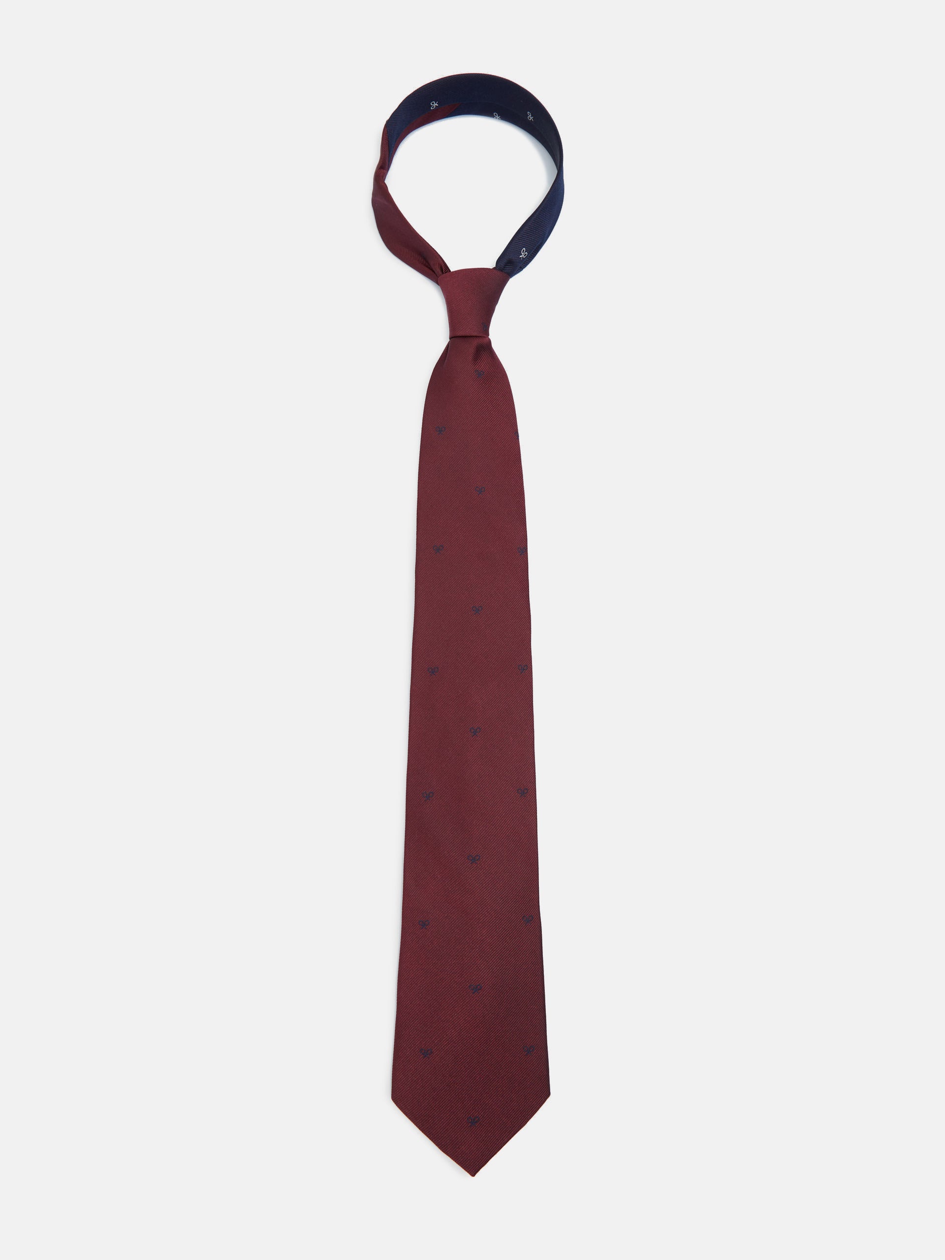 Cravate en silbon à motifs raquettes bordeaux